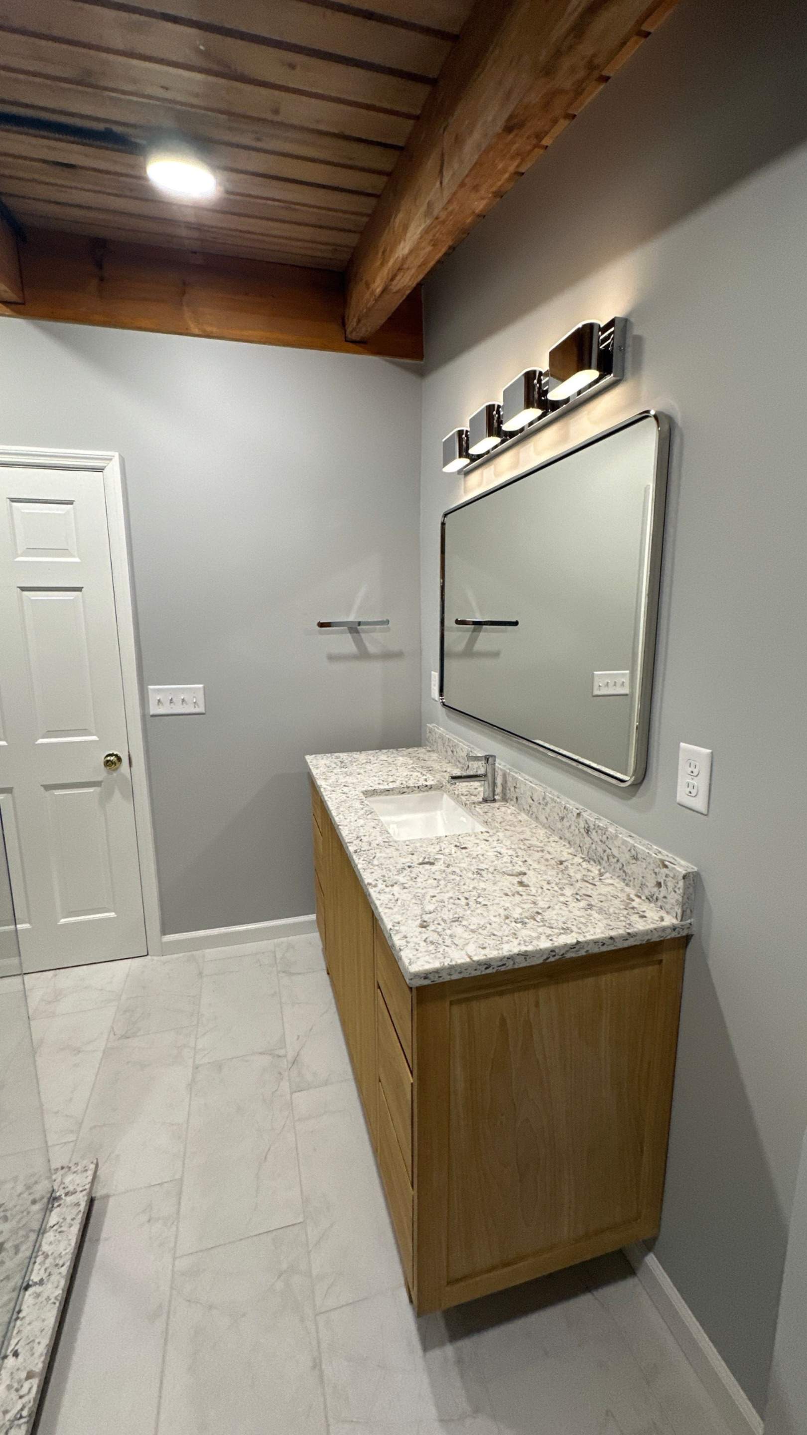 Brandt Double Bathroom Remodels by Integrity Tile and Home LLC