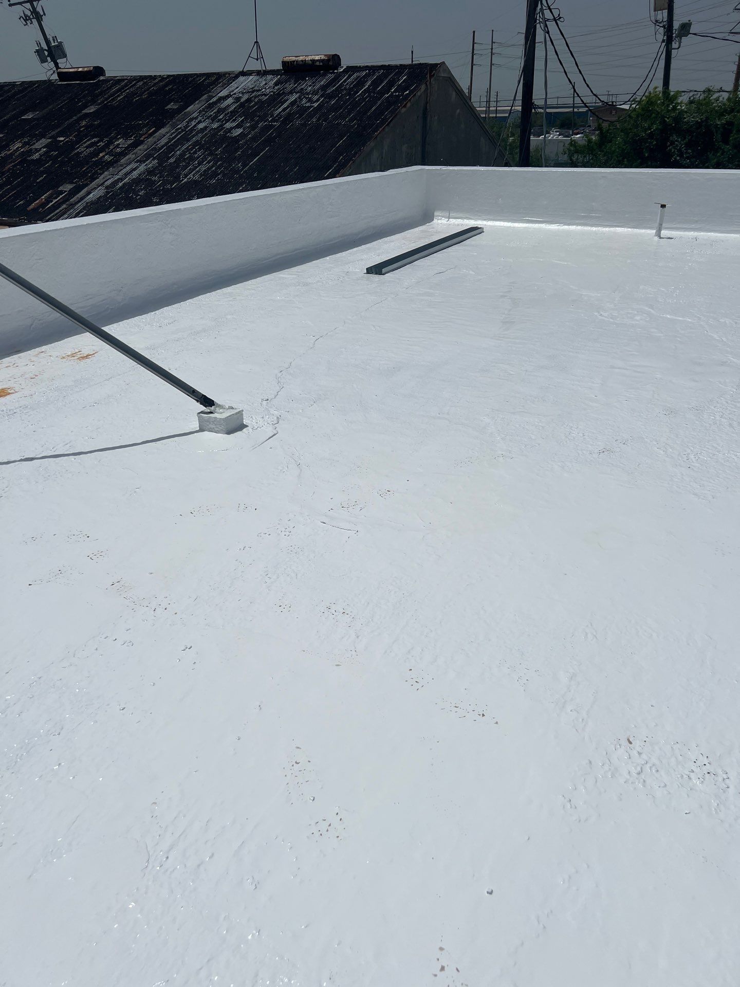 Dirty leaking Gravel Roof by Bayfront Roofing and Construction