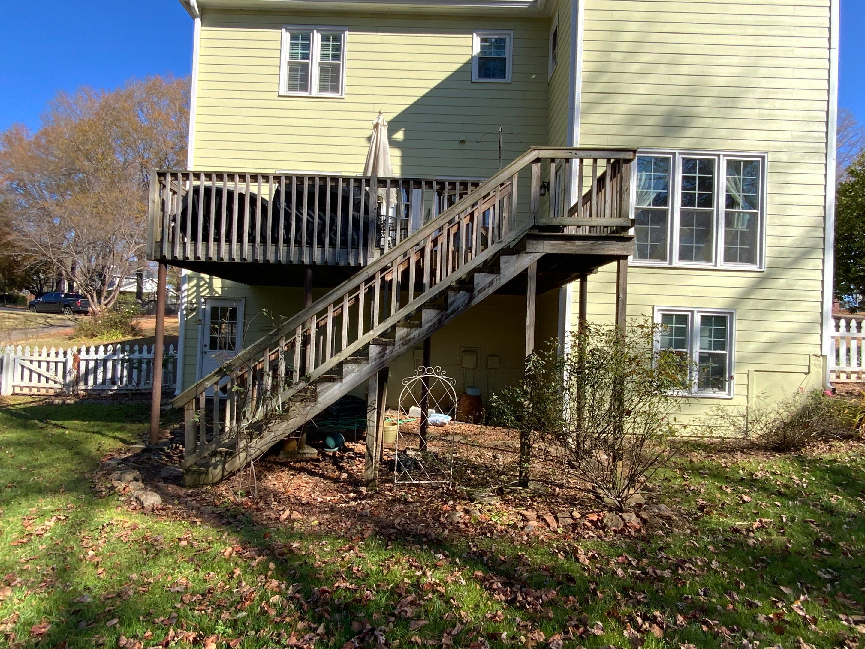 Elevated Grey Composite Deck Installation in Woodstock, Georgia by Swift Home Renovations