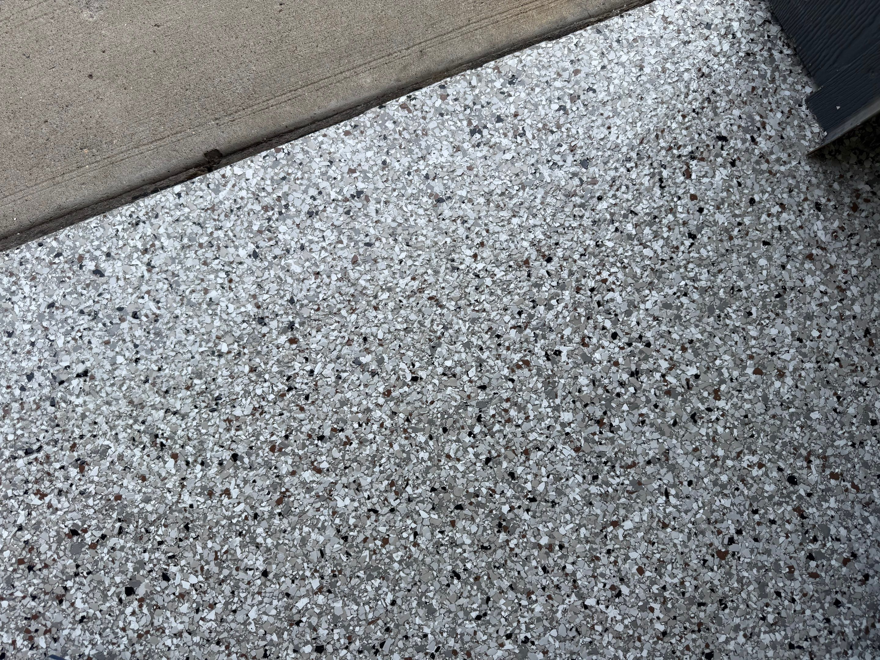 Full Garage Floor Resurfacing and Decorative Epoxy Flake Finish by Select Painting, Coatings & Garage Cabinets