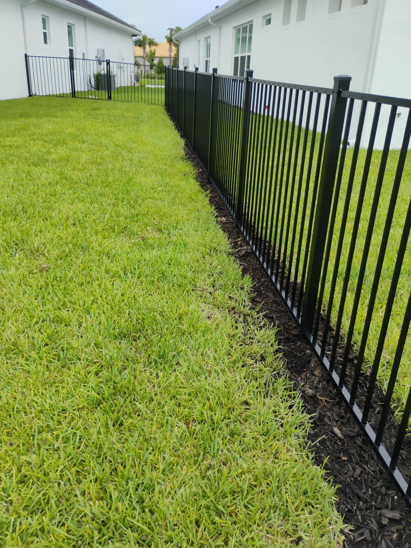 Black Aluminum Picket Fence Installation in Venice, Florida by True Fence LLC