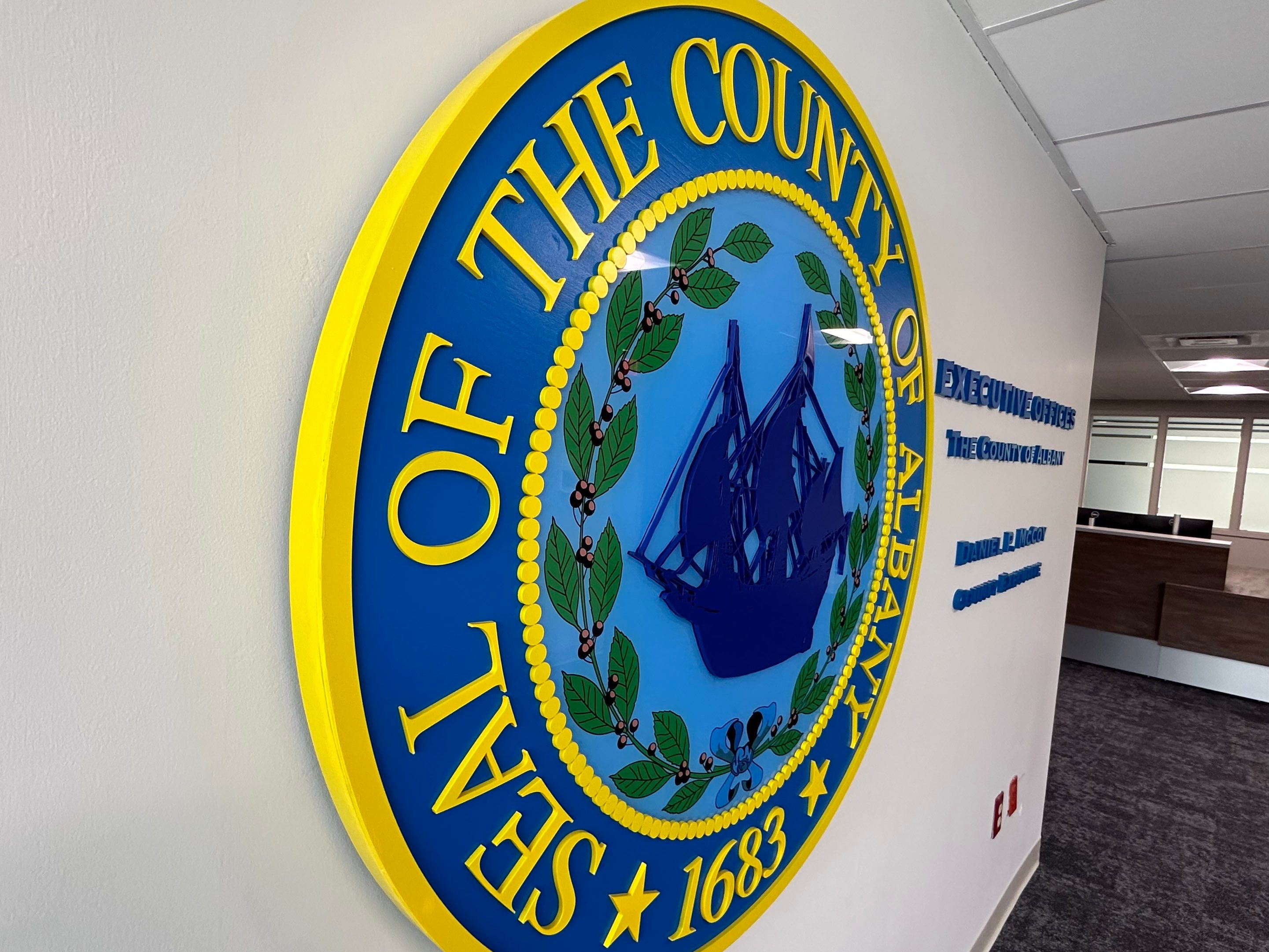 Albany County Executive Offices Dimensional Seal & Lettering Installation by FASTSIGNS of Saratoga Springs