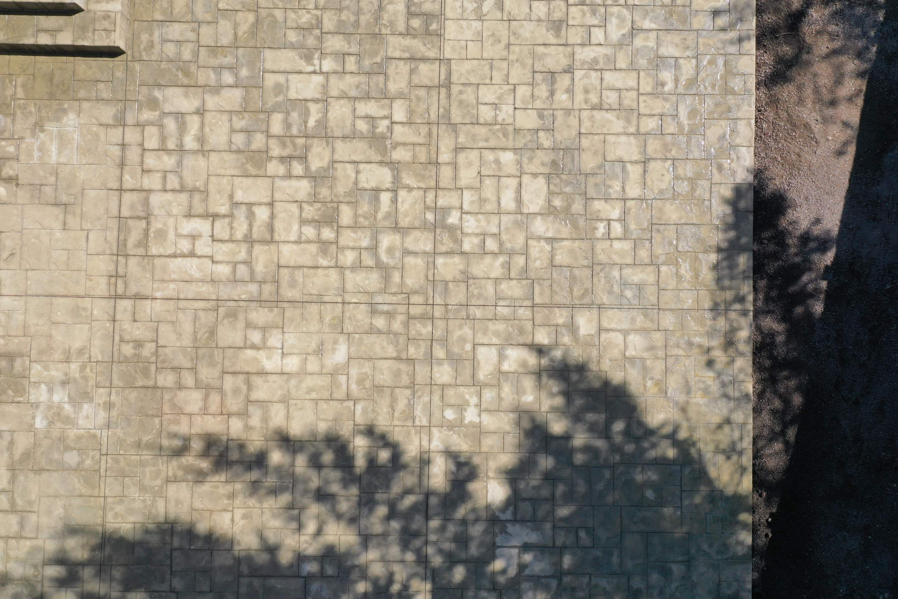 Benedict | Stamped Concrete Back Patio by Jireh Asphalt & Concrete Inc 