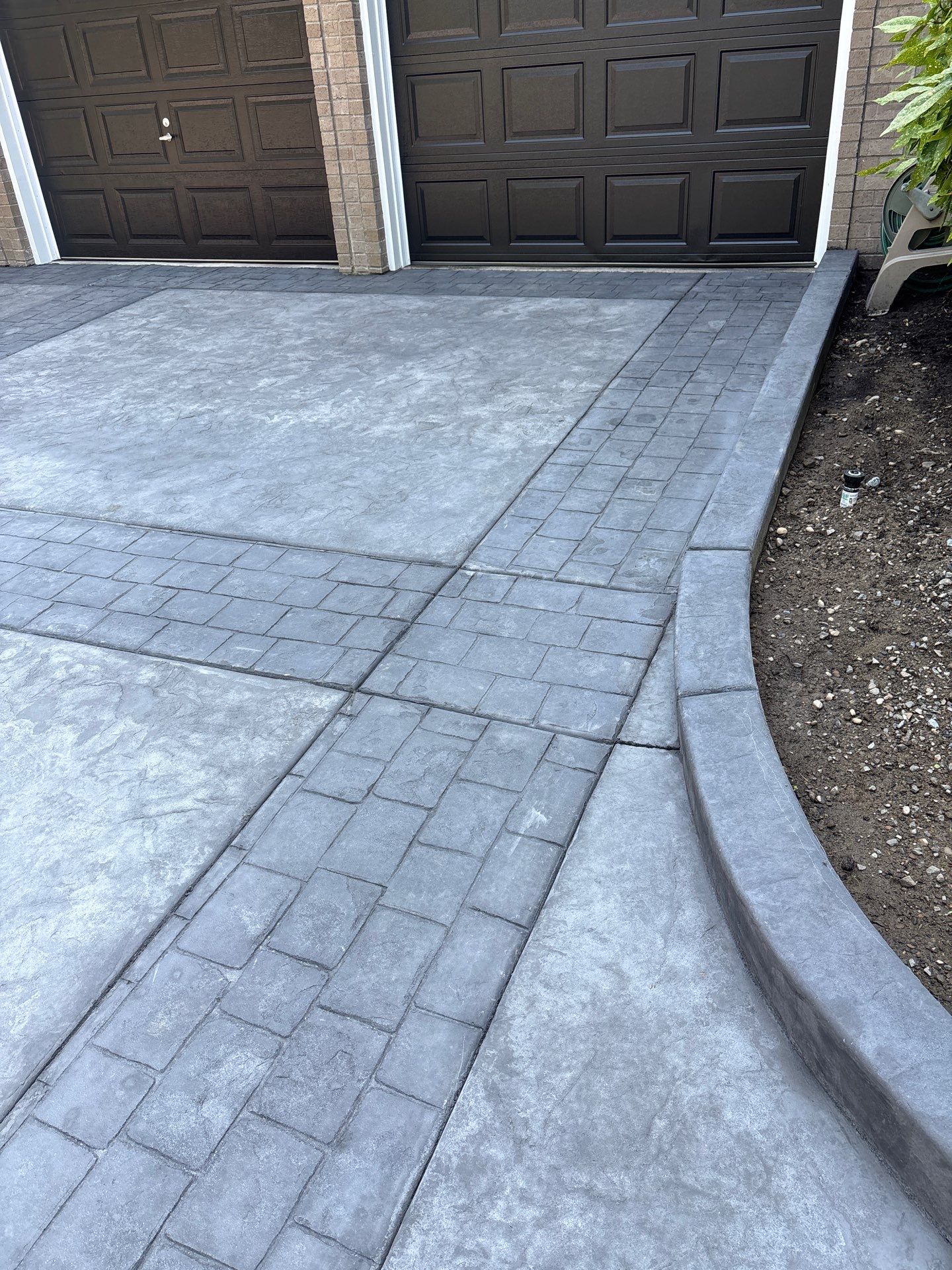 Multi-color Stamped & Sealed Concrete Driveway Renovation | Mukilteo by Jireh Asphalt & Concrete Inc