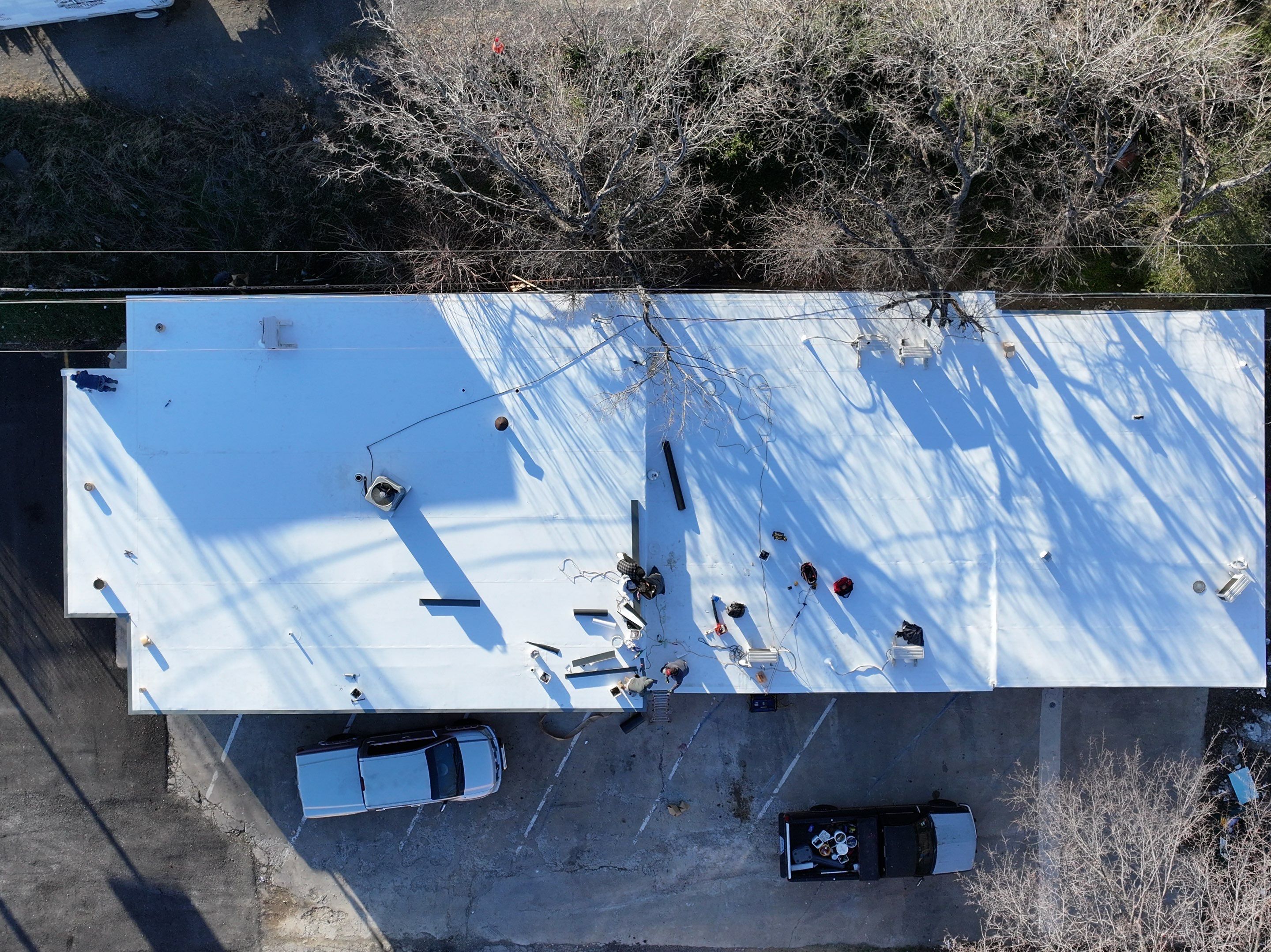 Commercial roofing overlay using GAF TPO over an old ballast roof by Becker Roofing and Exteriors