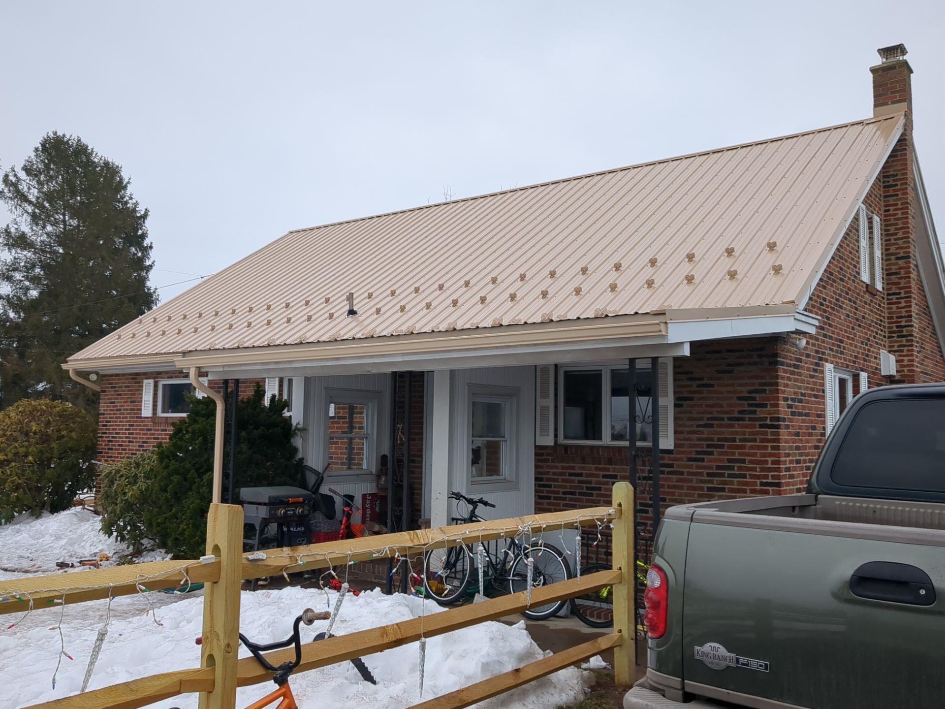 Tan Metal Roof and Gutter Replacement for Valley View Home by Esh Builders