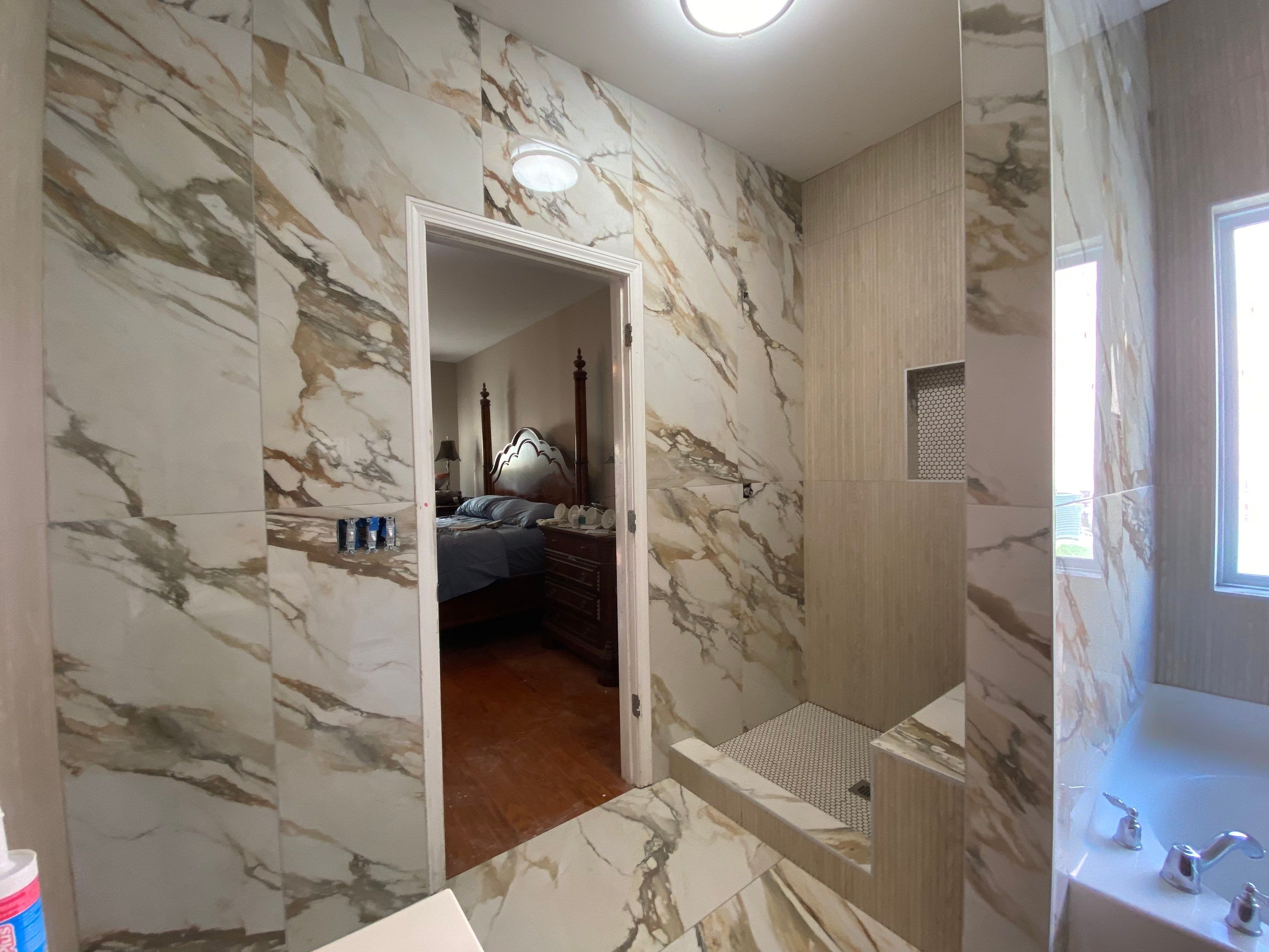 Beautiful new custom tile shower, tub surround and accent walls by Footprints Floors of Nashville