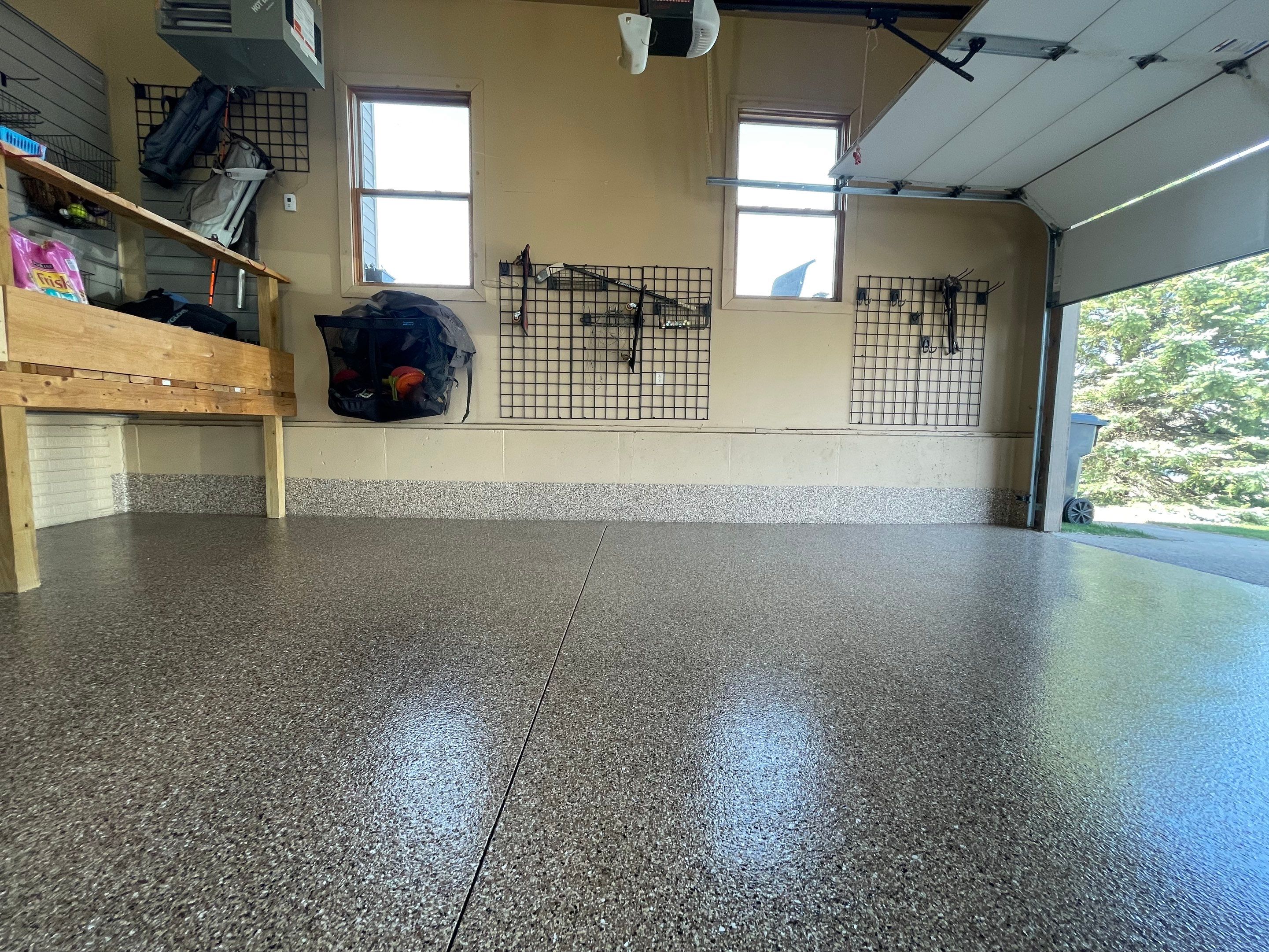 Residential Garage Floor Transformation with Speckled Epoxy Coating by Select Painting, Coatings & Garage Cabinets