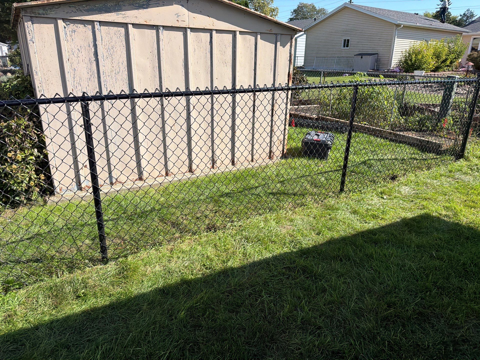 Custom Vinyl Privacy and Black Chain Link Fence Installation in Cedar Falls by Perfect Picket Fence and Stain