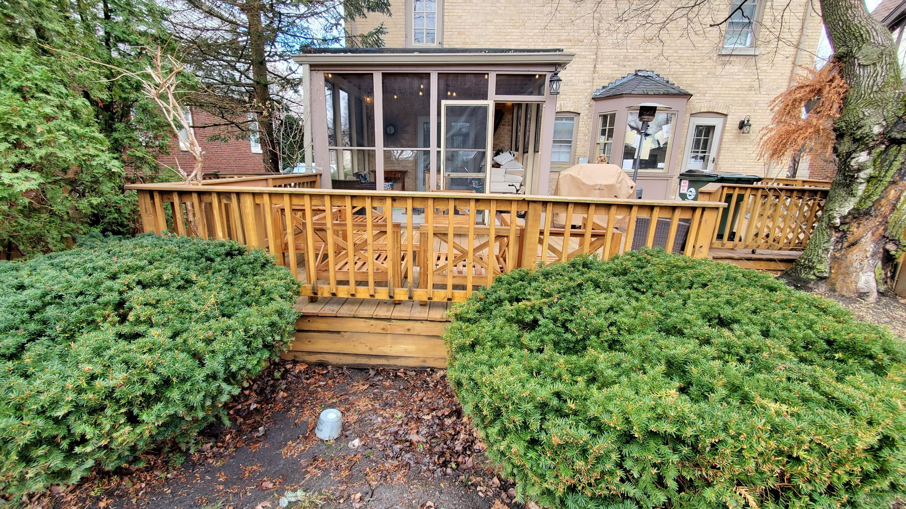 Wood cleaning and staining using Armstrong cloark oil stain by Northern Power Washing LLC.