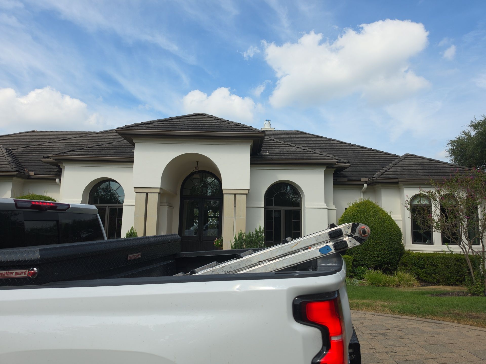 Tile roof and custom chimney cap by REPS Austin Area Roofer