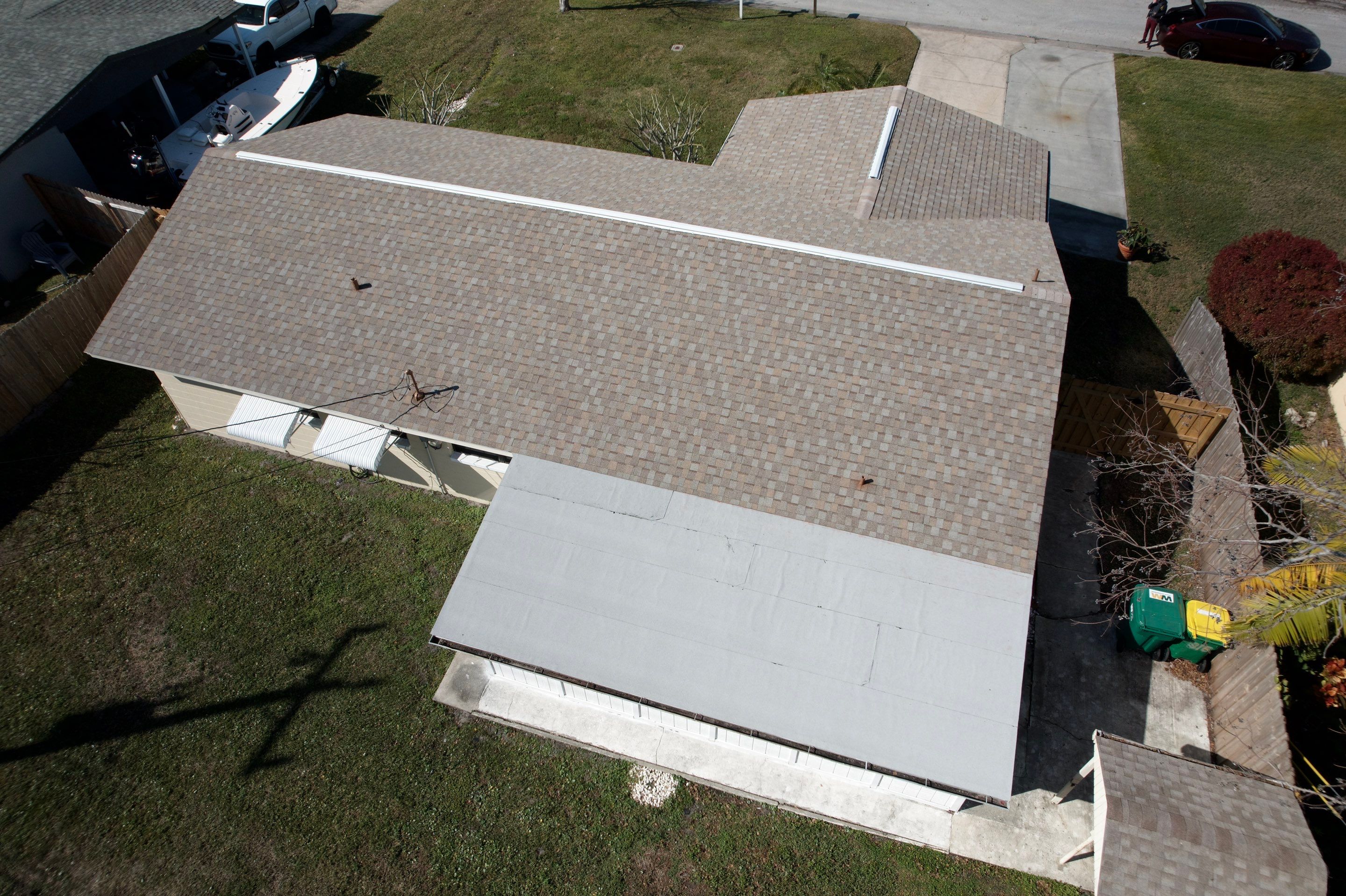 Complete Asphalt Shingle and Flat Roof Replacement in Merritt Island by Wiedmann Construction & Roofing