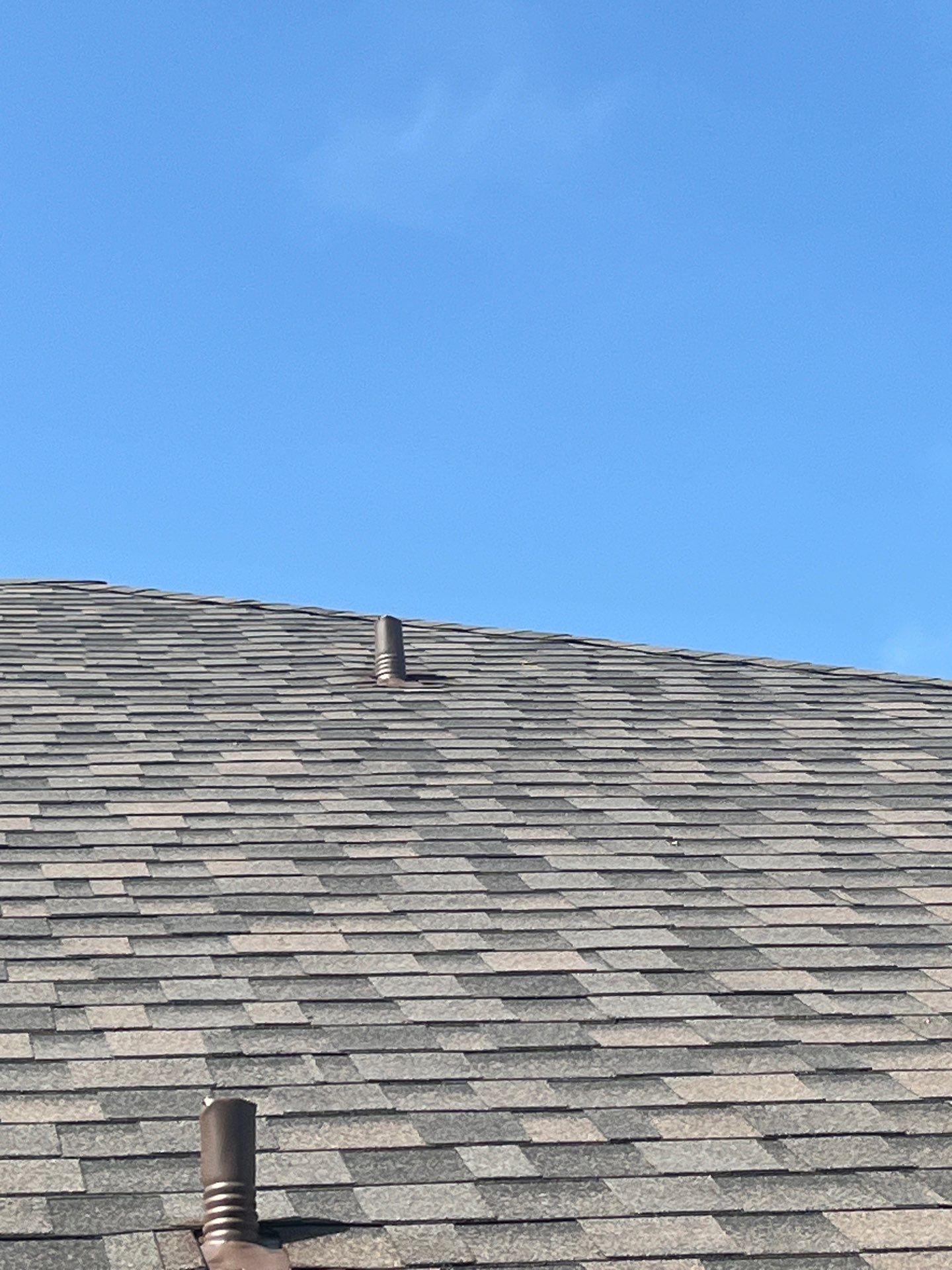 Medium brown brick with IKO Driftshake by Tejas Roofworks + Restoration