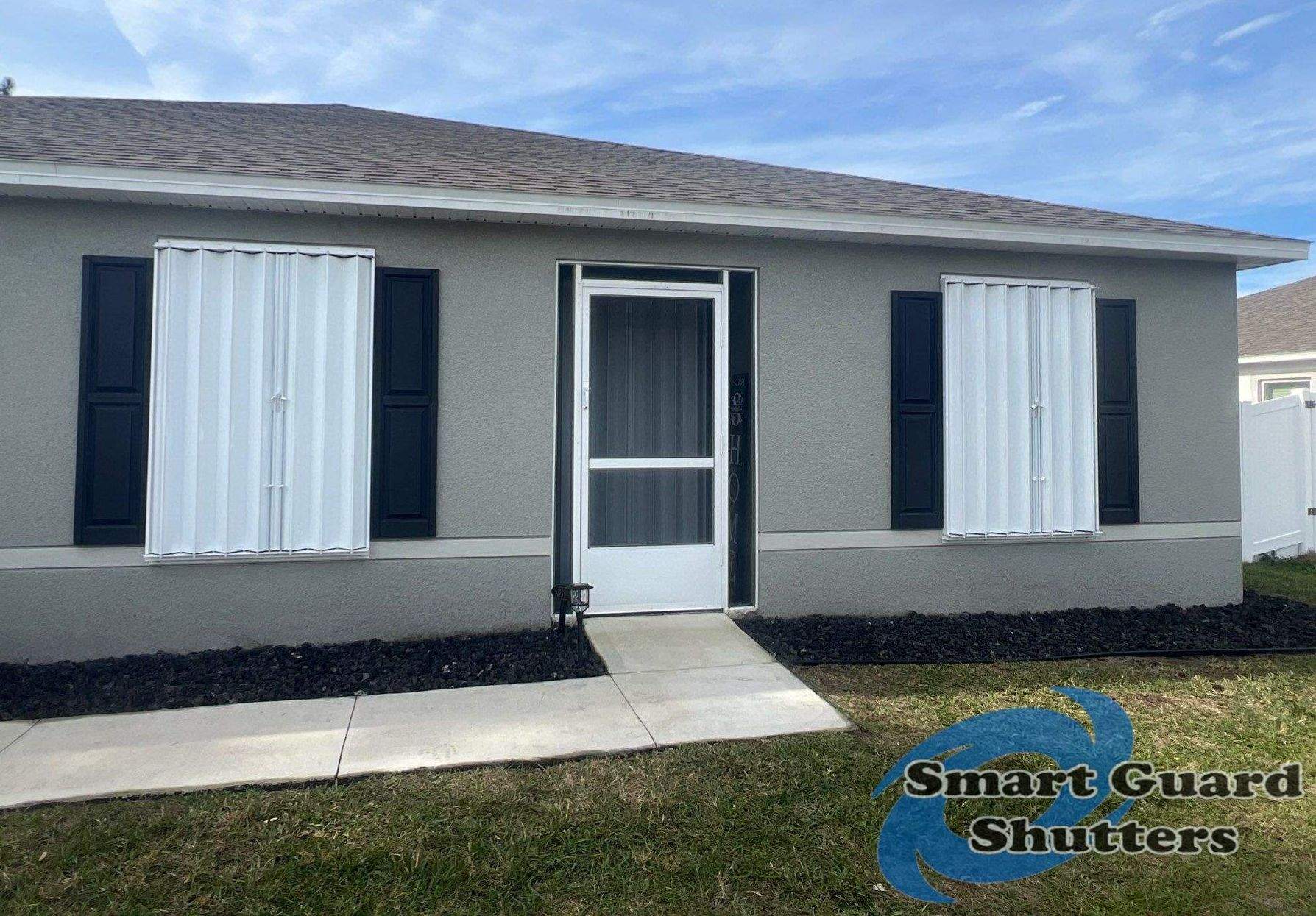 Accordion Shutters in White by Smart Guard Shutters