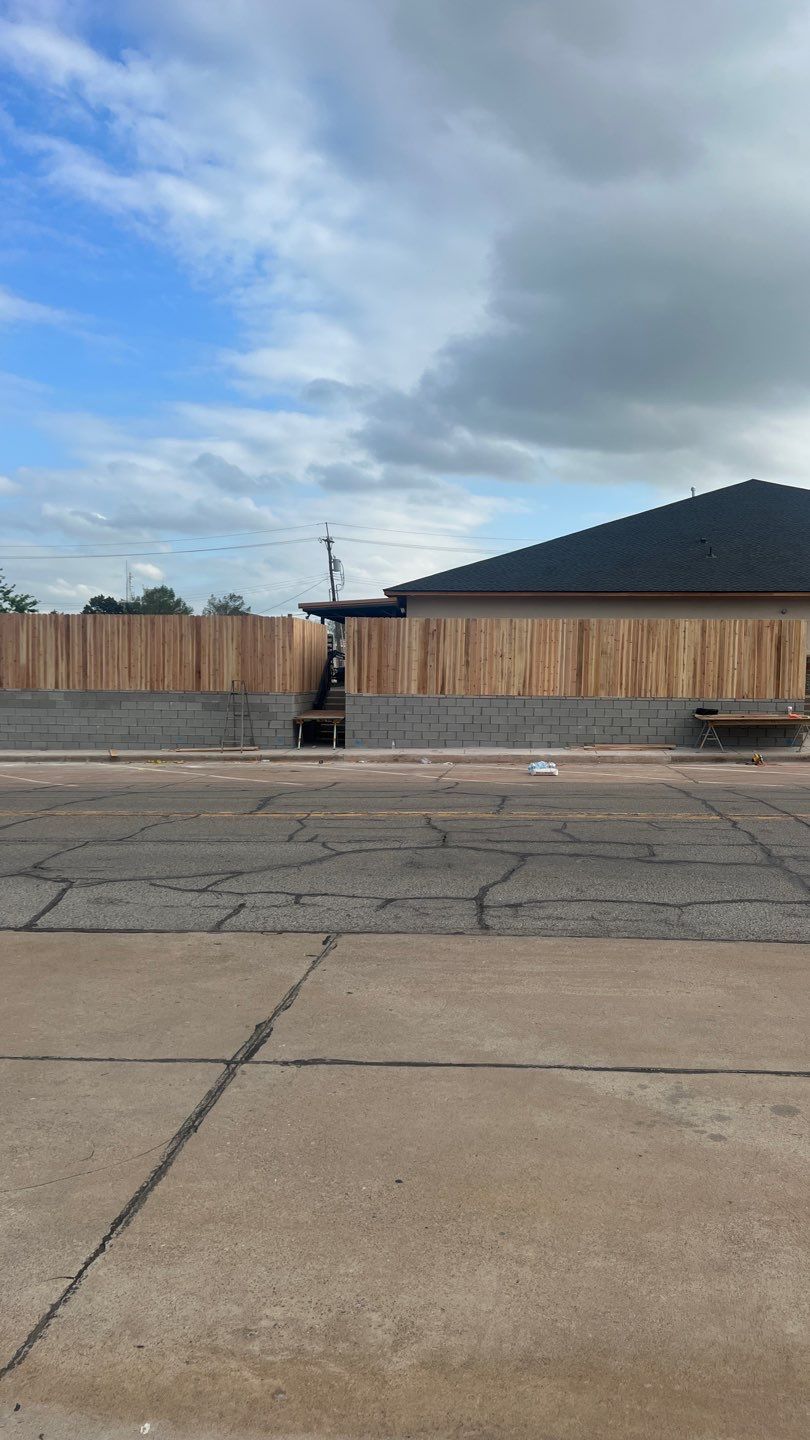 Cedar Fence using Cedar Pickets and Metal Poles by Clays Services Inc