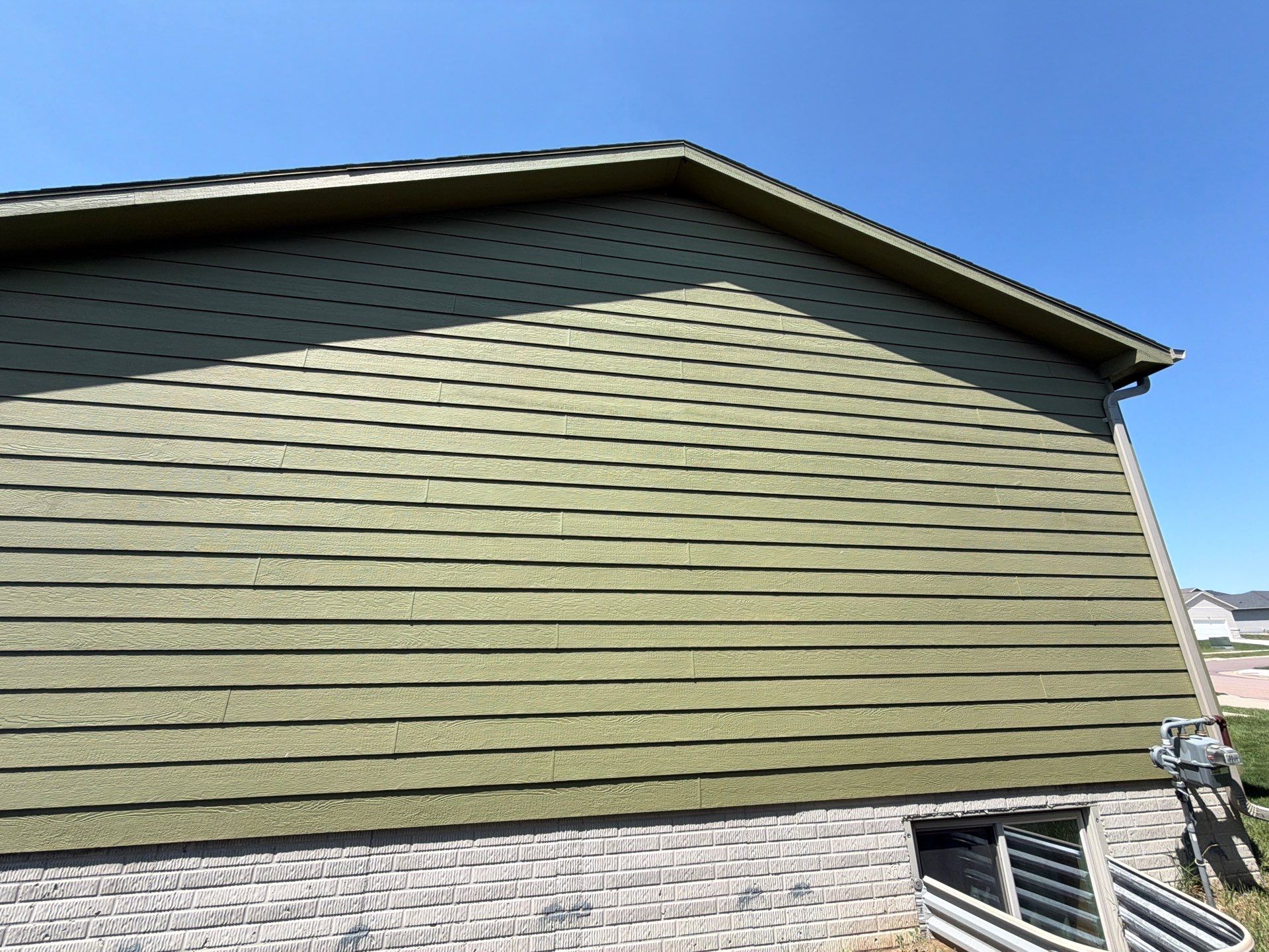 Exterior Painting and Custom Deck Construction in Sioux Falls by Select Painting, Coatings & Garage Cabinets