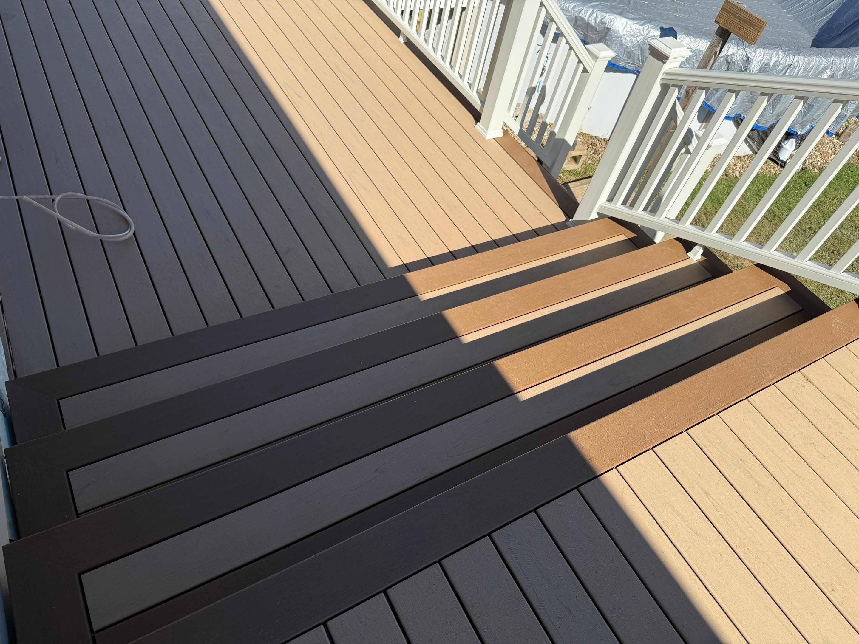 Replacement pool deck with Trex Lineage Carmel and Transcend railings by DiGiorgi Roofing and Siding Inc