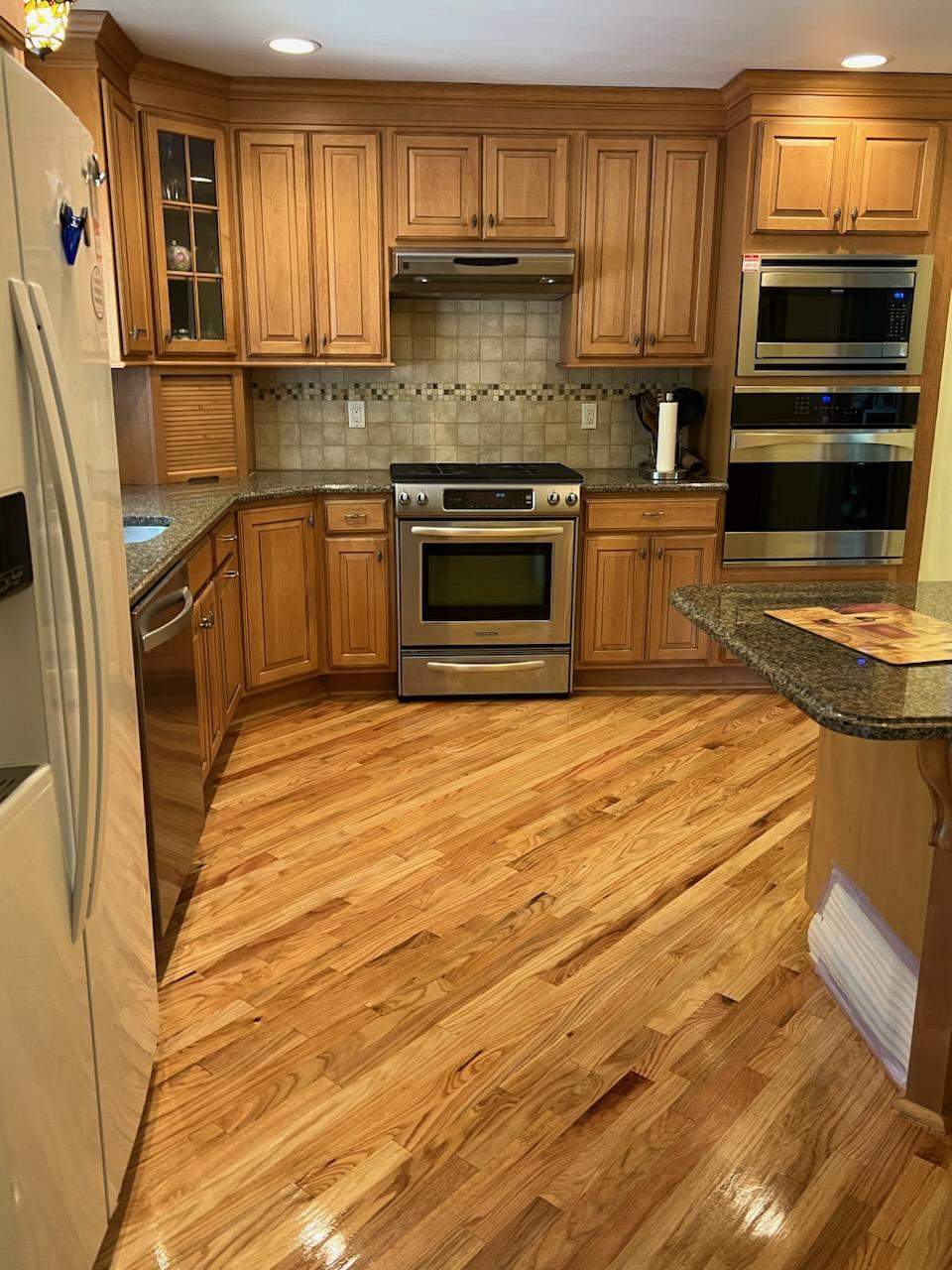 Sand and Refinish Red Oak Kitchen Floor by Footprints Floors Morristown