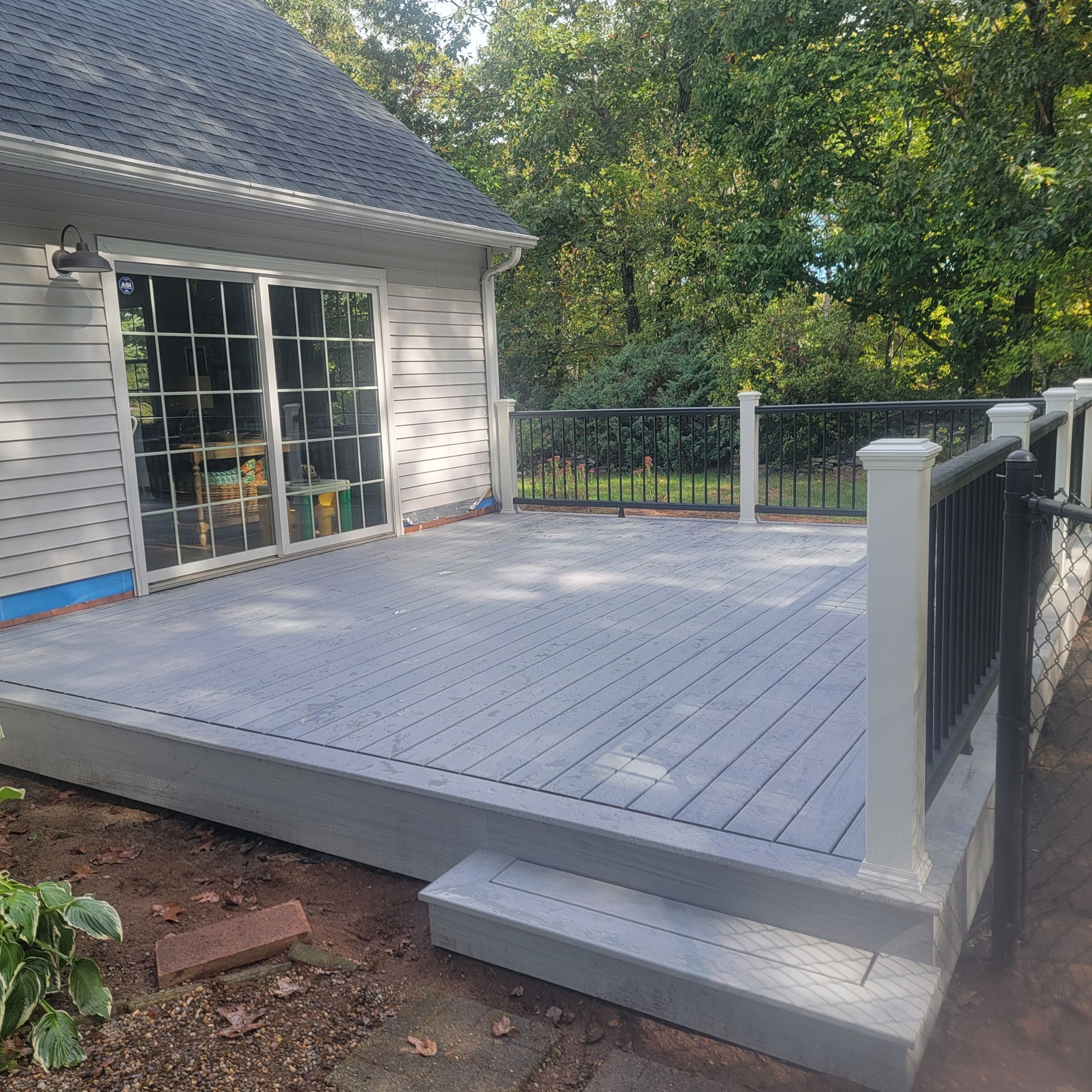 Deck replacement using Trex lineage Rainier and Black and White Transcend railings by DiGiorgi Roofing and Siding Inc