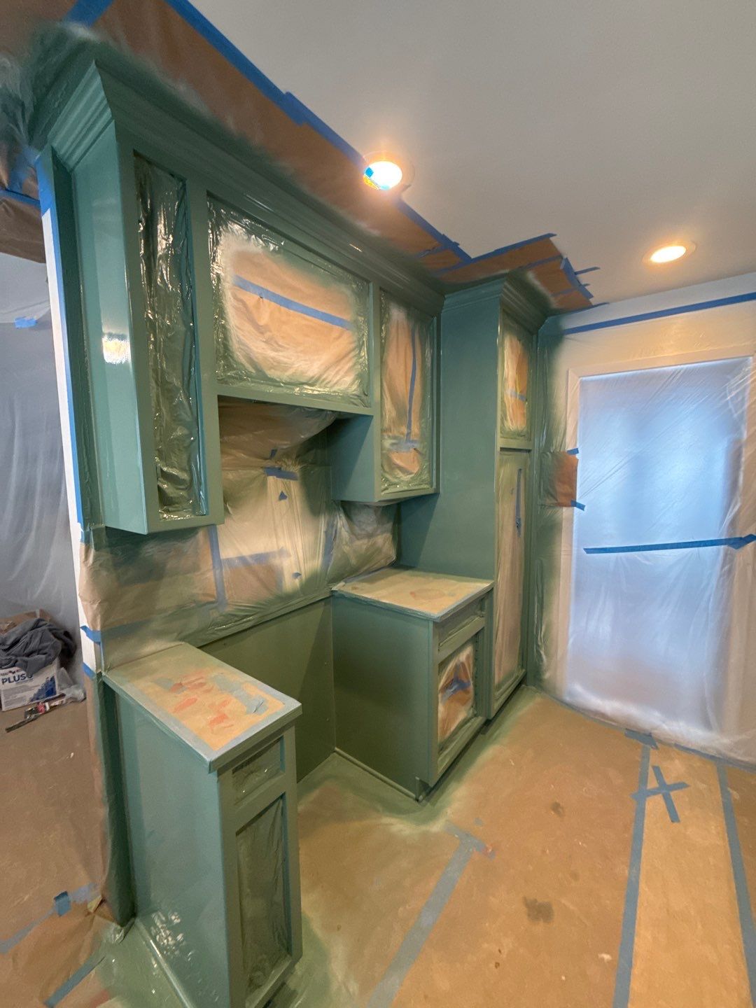 Elegant Transformation: Stained Cabinets Revamped with Sherwin-Williams Juniper by Cougar Painting