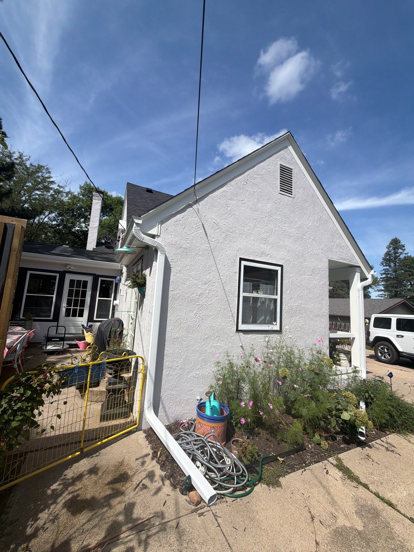 Exterior Stucco Painting and Trim Refresh in Sioux Falls by Select Painting, Coatings & Garage Cabinets