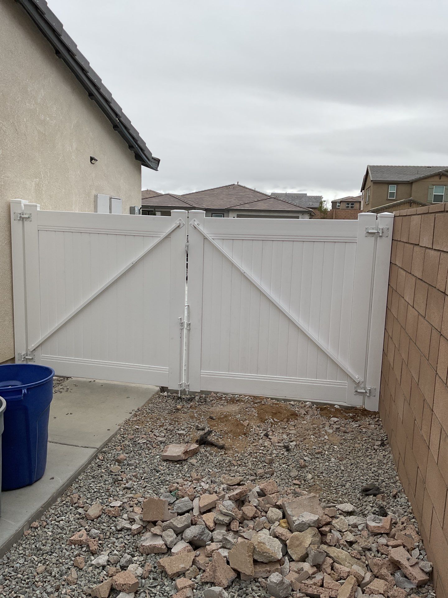 Gate installation using Vinyl by Fence Guys Inc. 