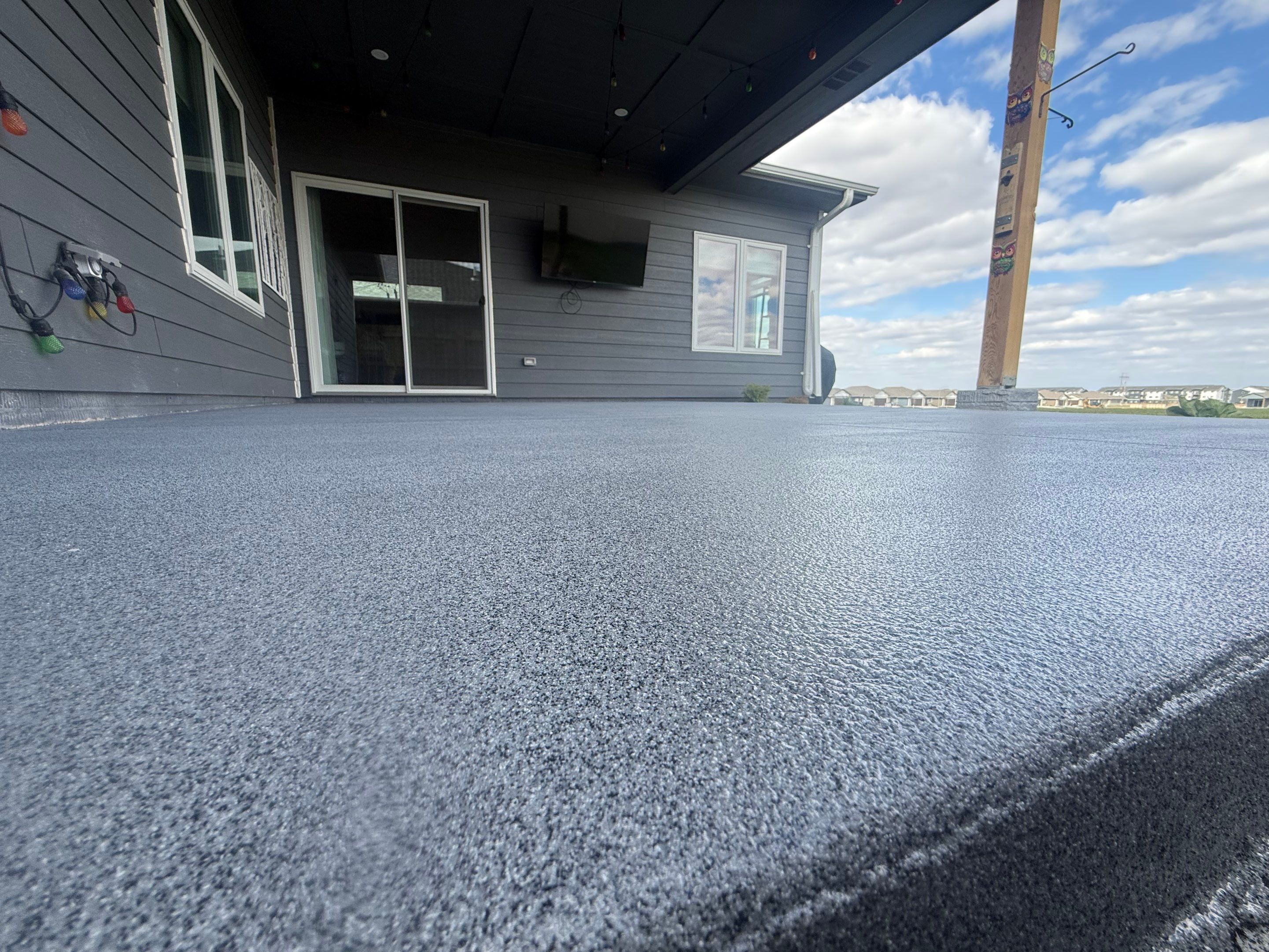Decorative Flake Concrete Coating for Sioux Falls Porch and Patio by Select Painting, Coatings & Garage Cabinets