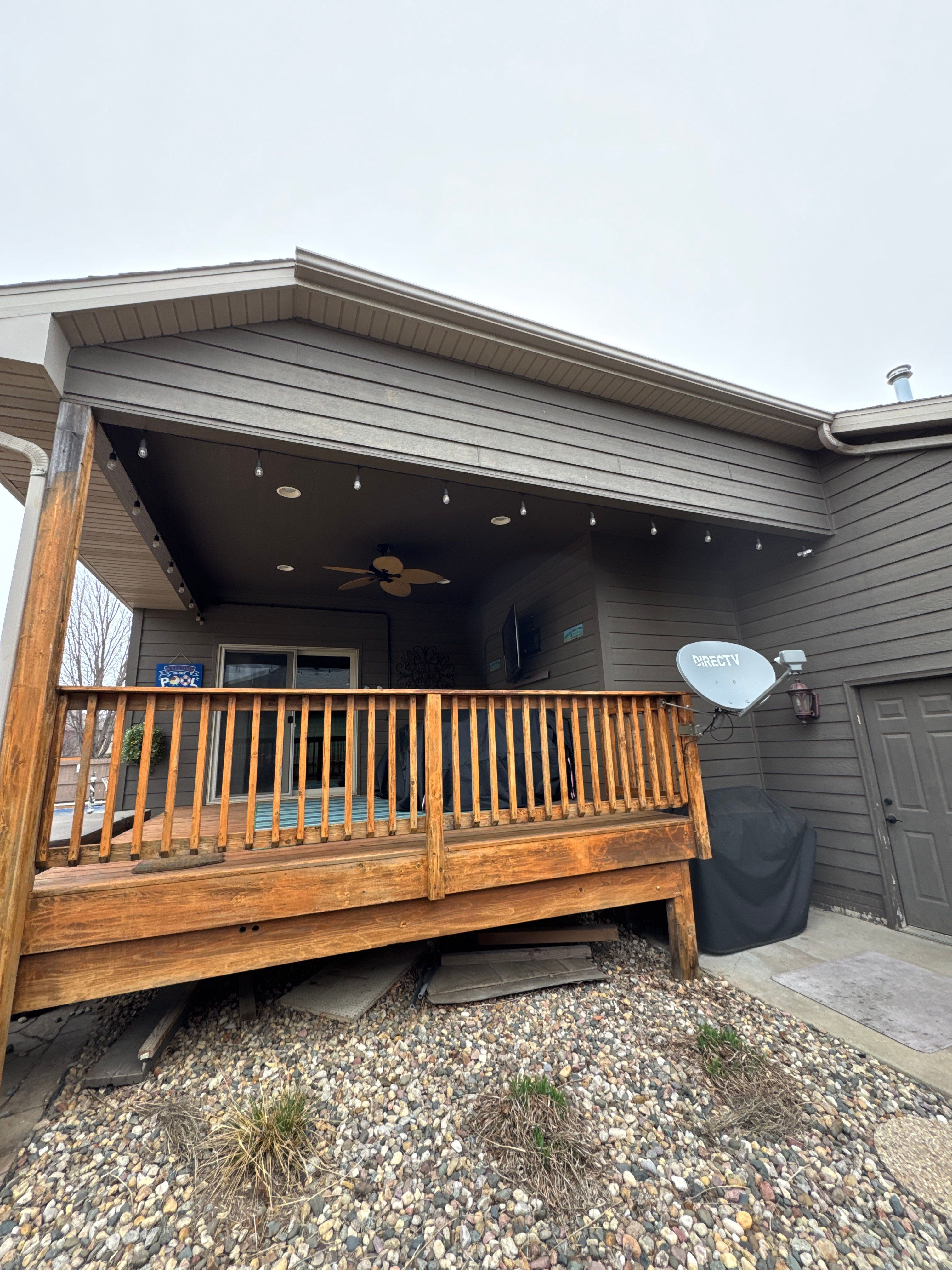 Sioux Falls Residential Exterior Update and Flagstone Pool Deck by Select Painting, Coatings & Garage Cabinets