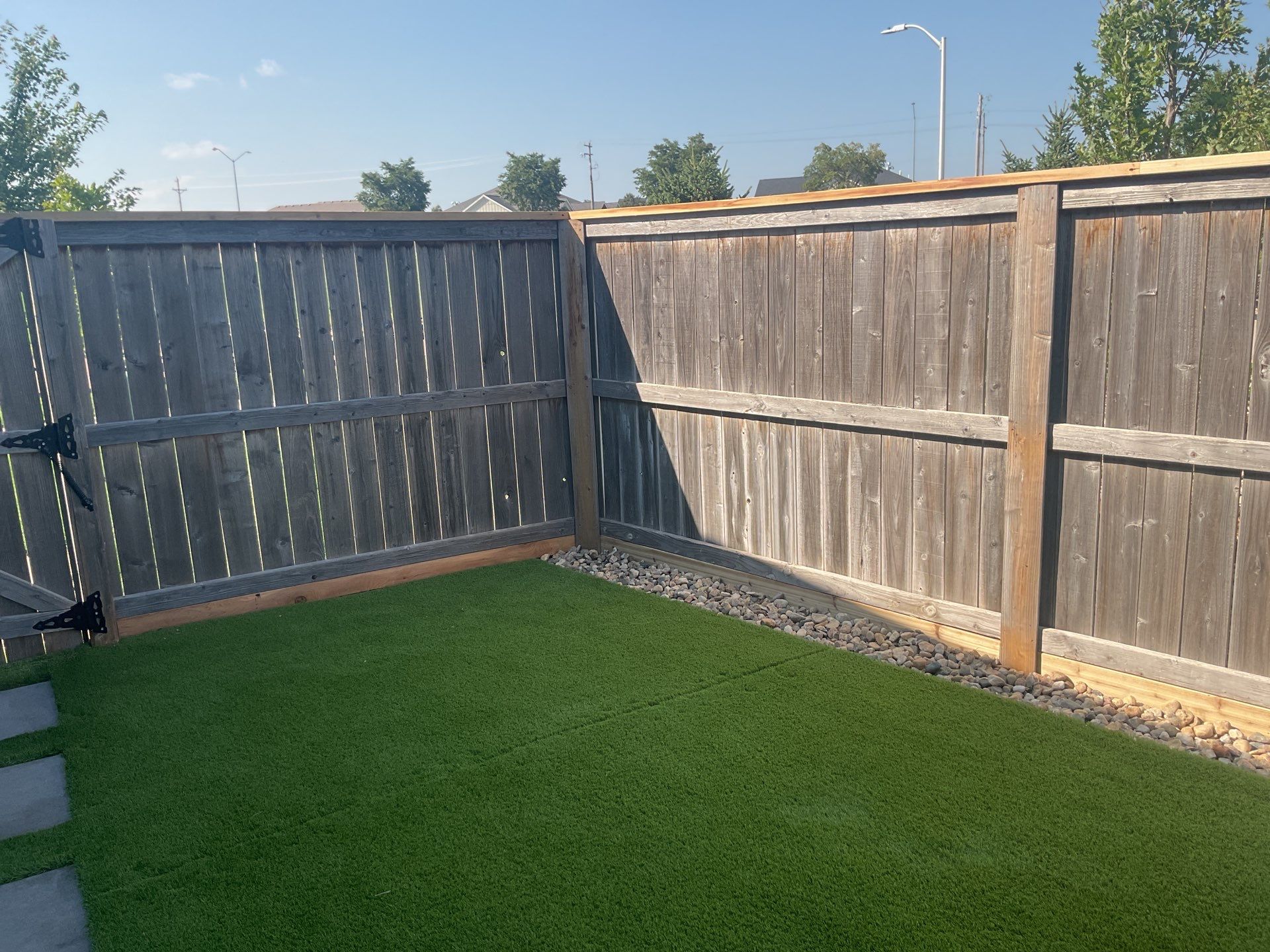 Custom Privacy Fence and Paver Patio Installation in Sioux Falls by Select Painting, Coatings & Garage Cabinets