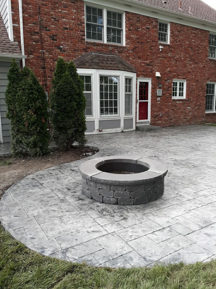 Back Yard Stamped Patio by LAND ESCAPES LLC