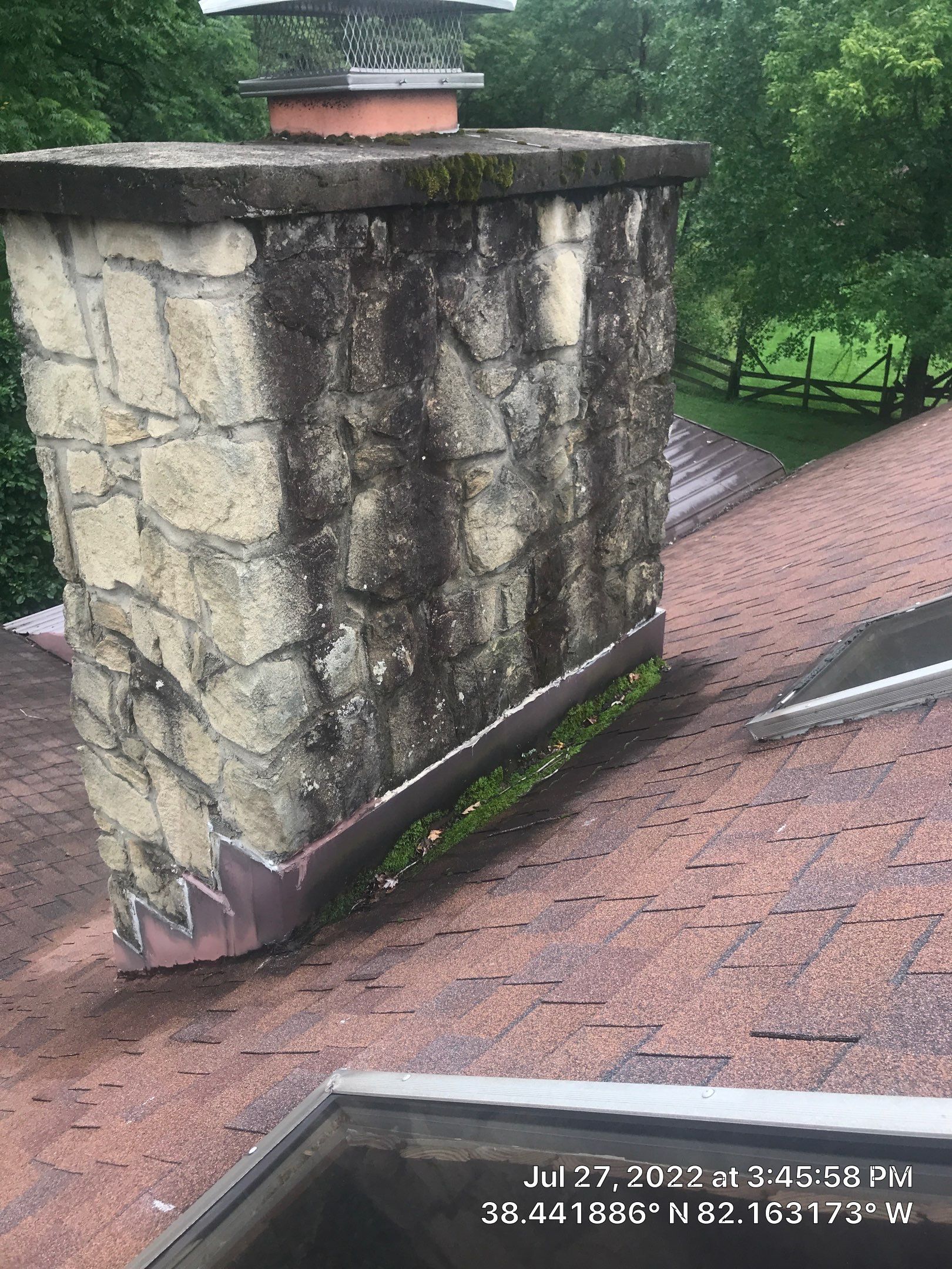 Shingle Roofing with Velux Skylight replacement and stone chimney flashing by Secure Construction Company Inc