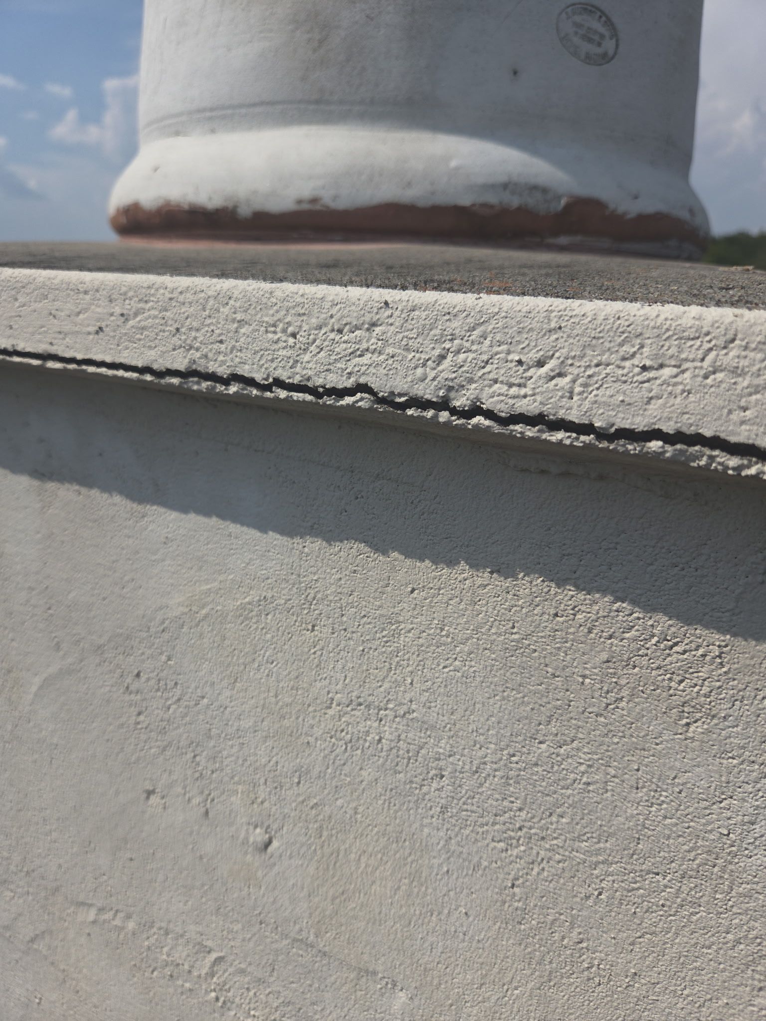 Tile roof and custom chimney cap by REPS Austin Area Roofer
