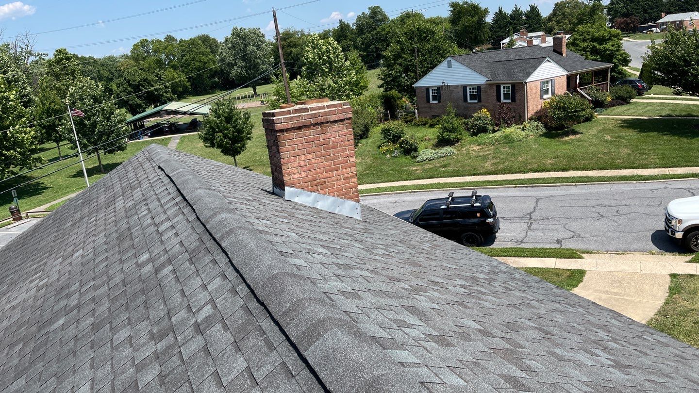 Residential Roofing Installation using Atlas Pinnacle Pristine Black Architectural Shingles by Frederick Roof Repair