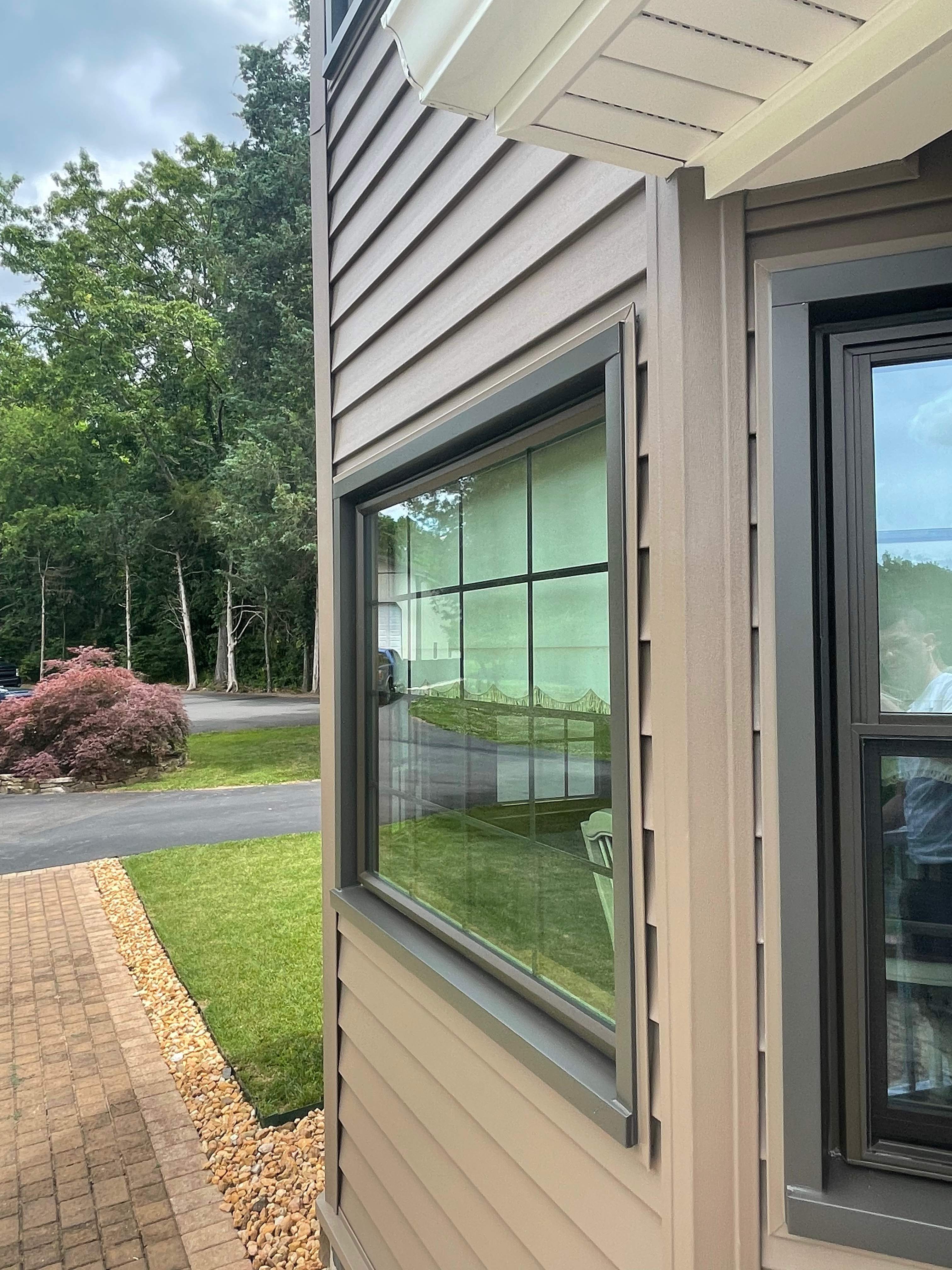 Exterior remodel including window replacement by American Home Contractors