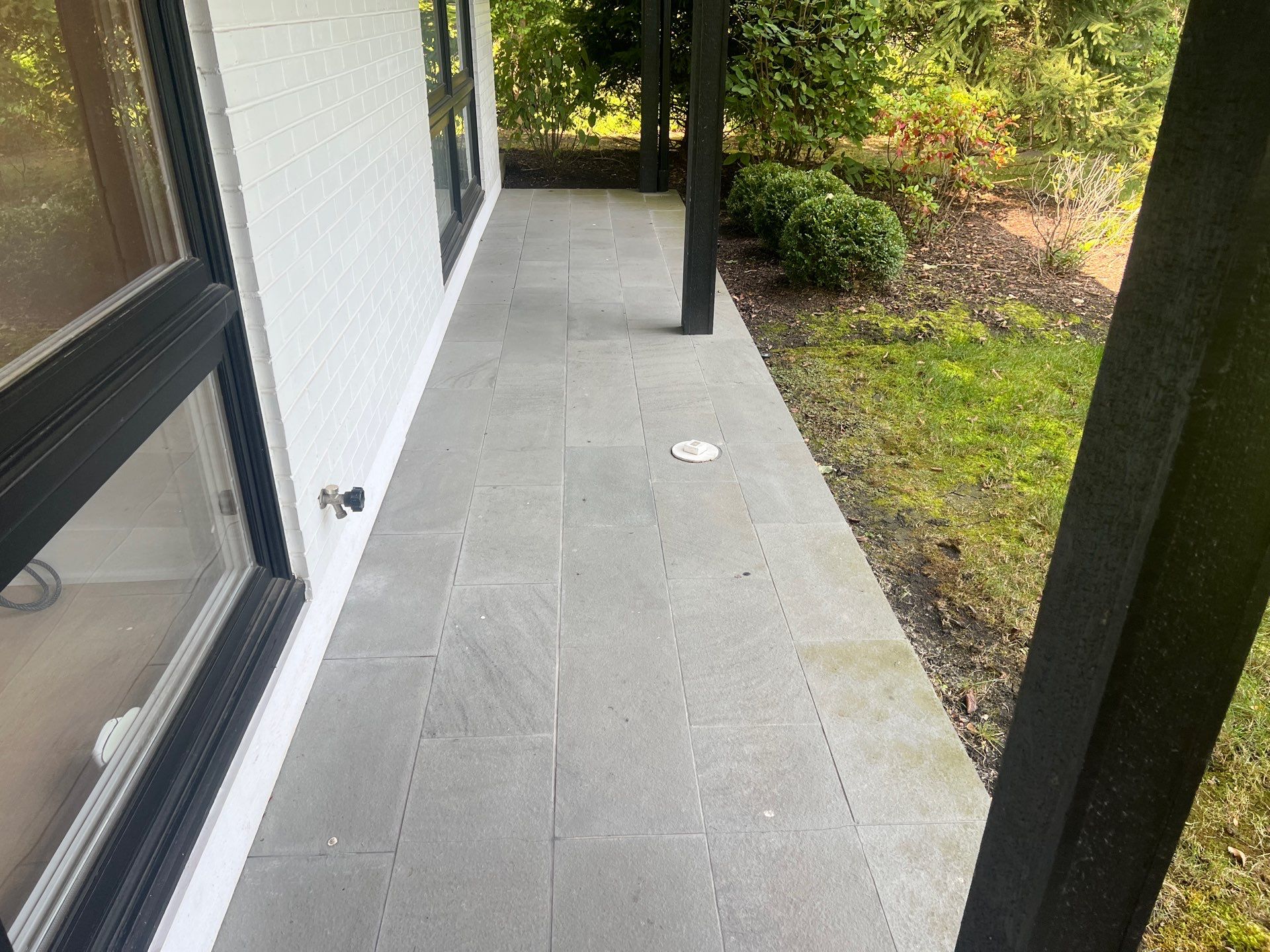 Complete Exterior House, Bluestone & Garage Floor Cleaning by Northern Power Washing LLC.