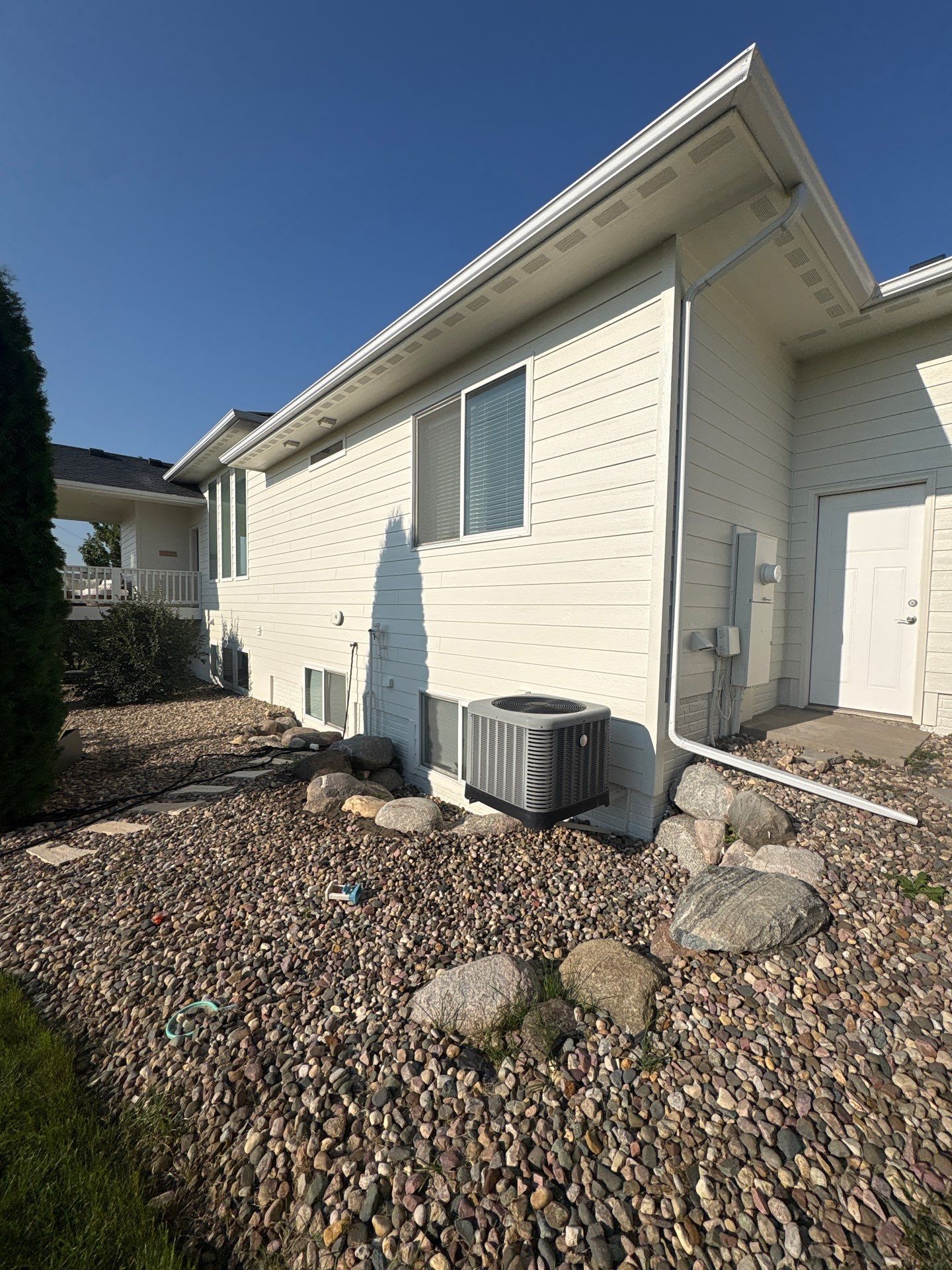 Sioux Falls Exterior Residential Siding and Deck Painting Project by Select Painting, Coatings & Garage Cabinets