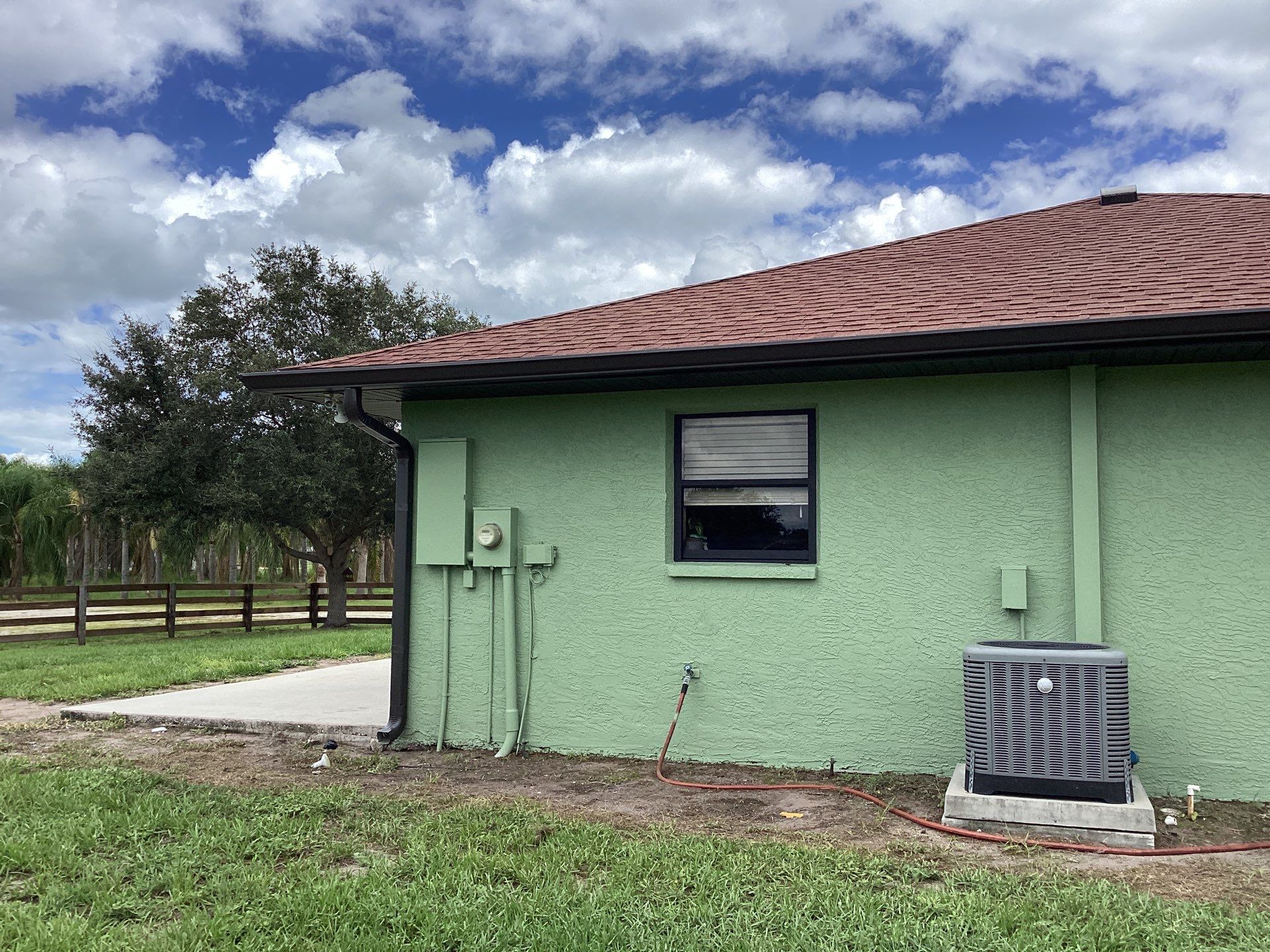 Musket brown downspouts with 6-inch K-Style gutter installation in Myakka City, FL by Gutter Professors