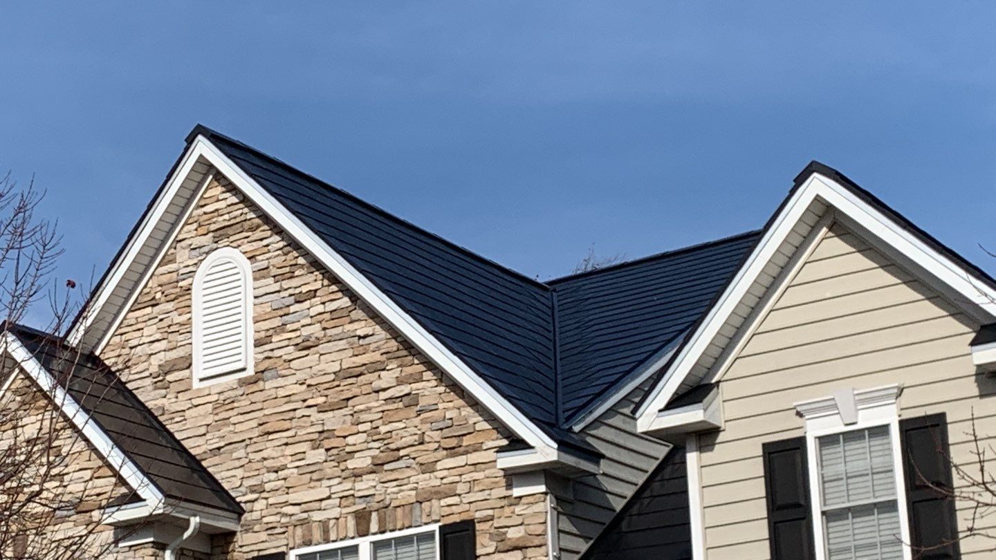 Tesla Solar Roof and Gutter Installation by American Home Contractors