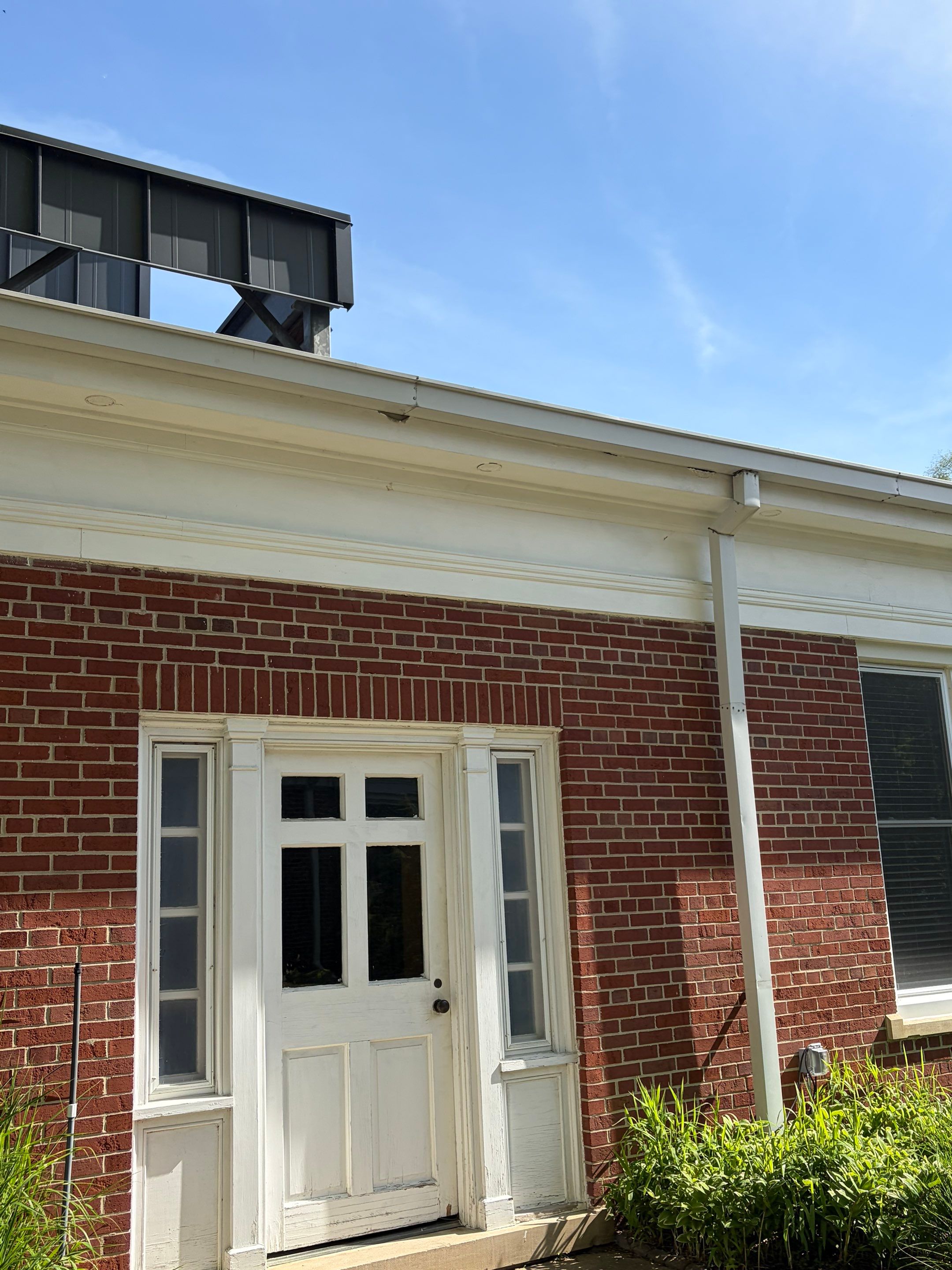 Commercial Wood Trim Restoration and Gutter Replacement in Birmingham by Top Shelf Painter