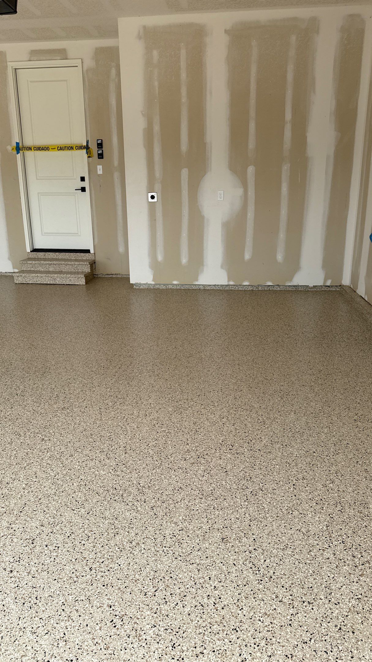 Raymore Garage Finishing With Custom Epoxy Floor Coating by Banner Garage