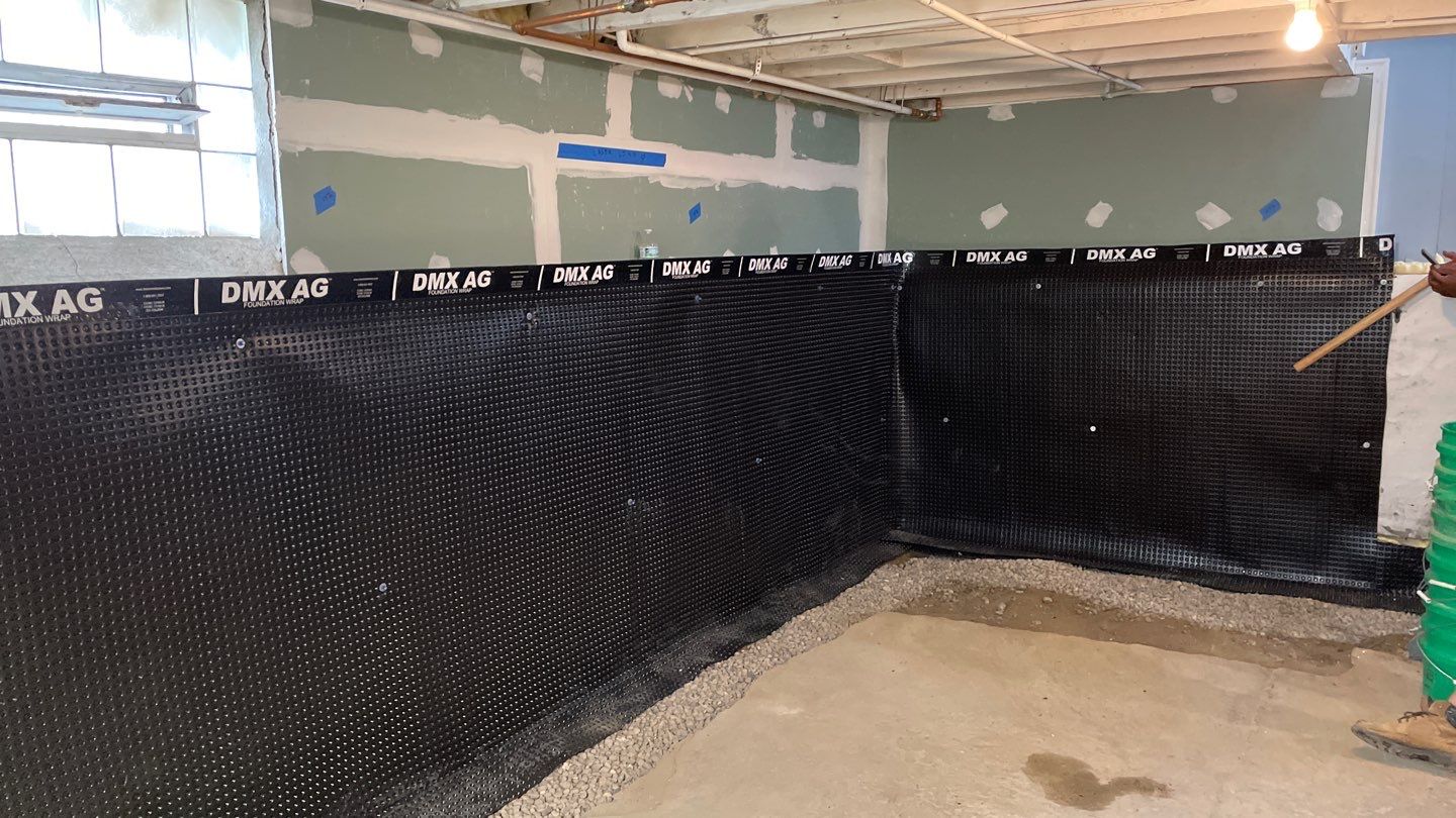 Drain Tile, Window Wells & Buried Discharge in Minneapolis by Waterproofing Northeast