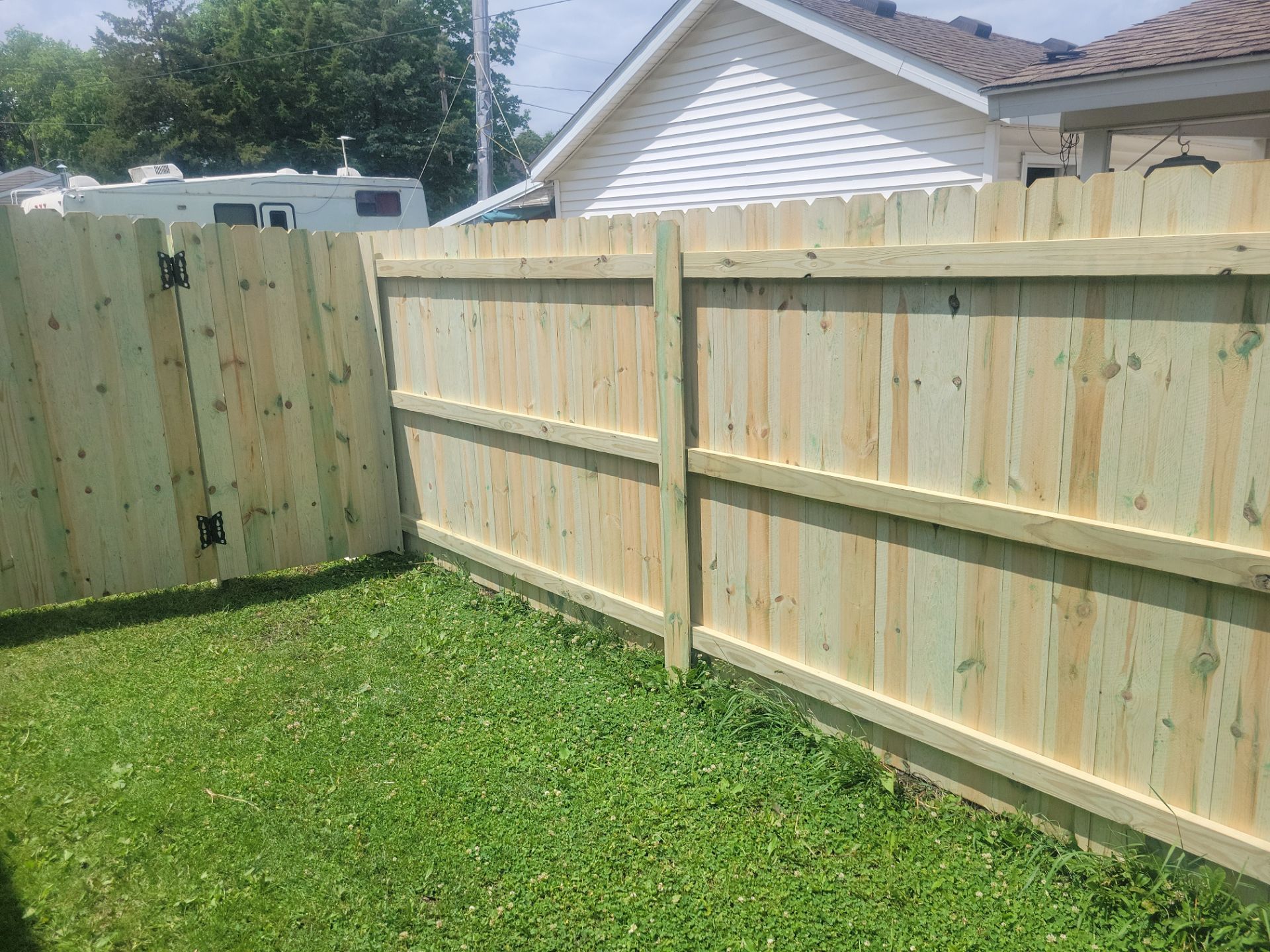 Pressure-Treated Wood Privacy Fence Installation in Charles City by Perfect Picket Fence and Stain