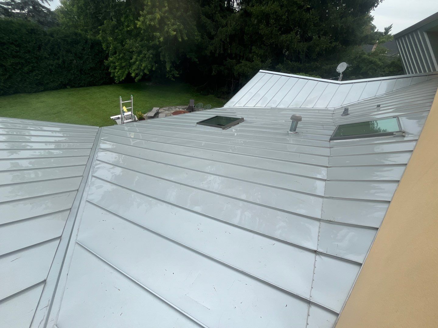 roof washing using Algaecide, soft wash soap by Northern Power Washing LLC.