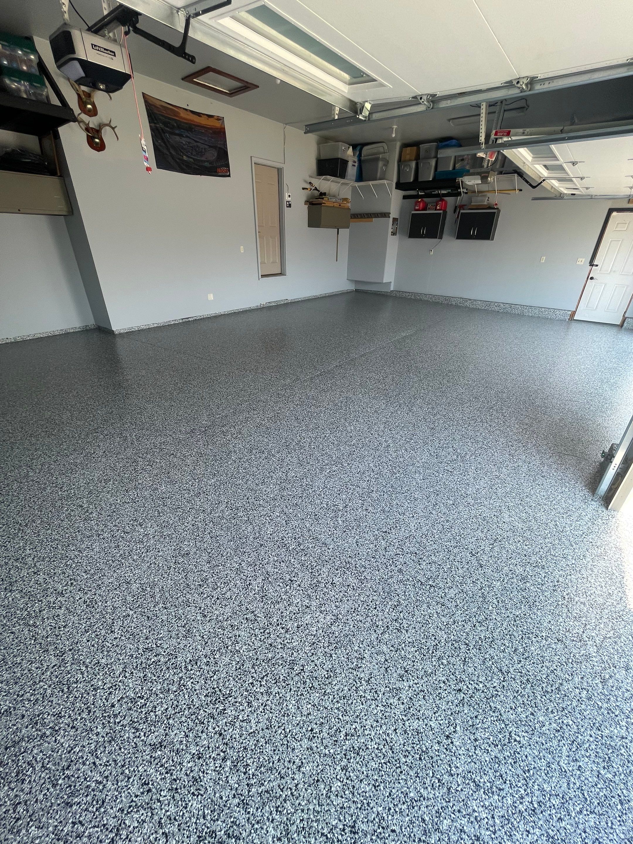 Sioux Falls Garage Concrete Coating Installation with Domino Flake by Select Painting, Coatings & Garage Cabinets