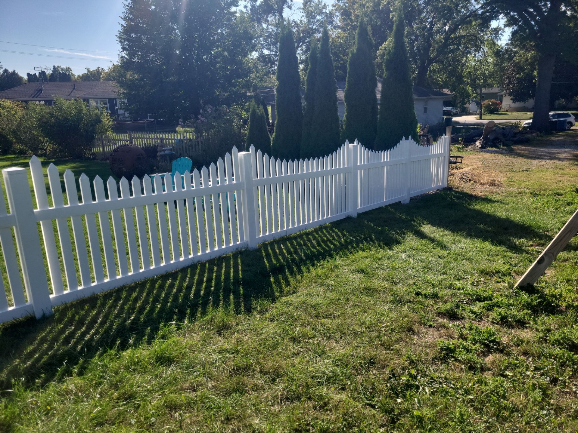 White Vinyl Spaced Picket Fence Installation in Waterloo by Perfect Picket Fence and Stain