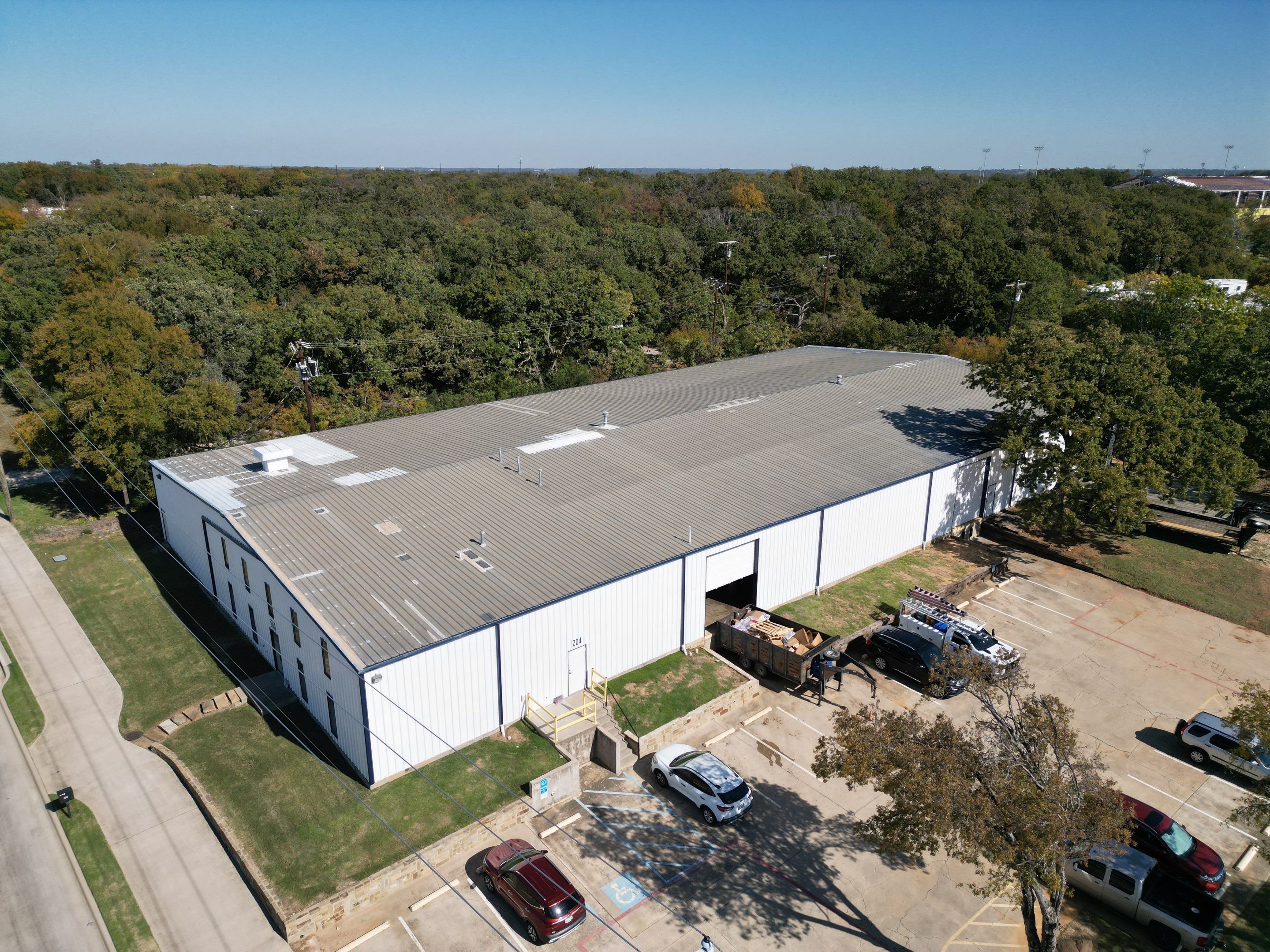 Silicone Coating Metal Rehab by First Out Roofing 