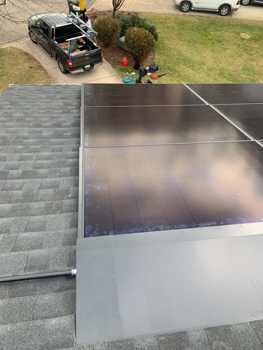 Roof Replacement with GAF Decotech integrated solar panels by American Home Contractors