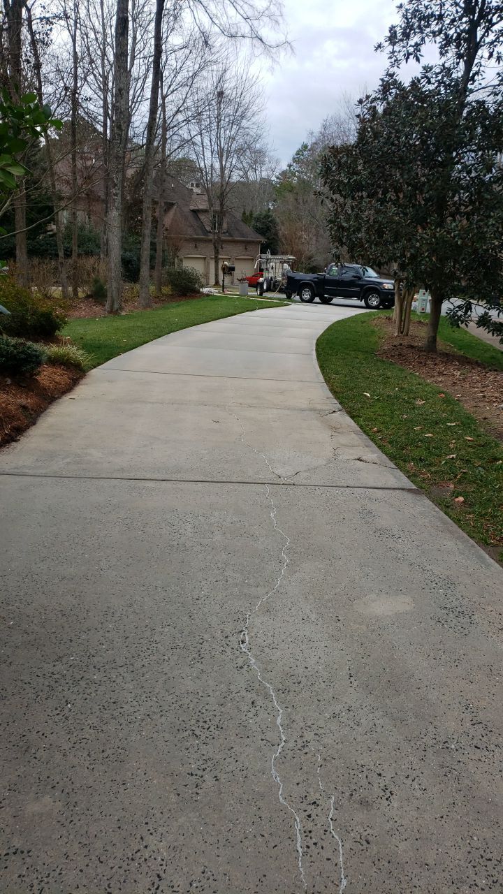Driveway Clean using cleaner by Power Wash Masters LLC