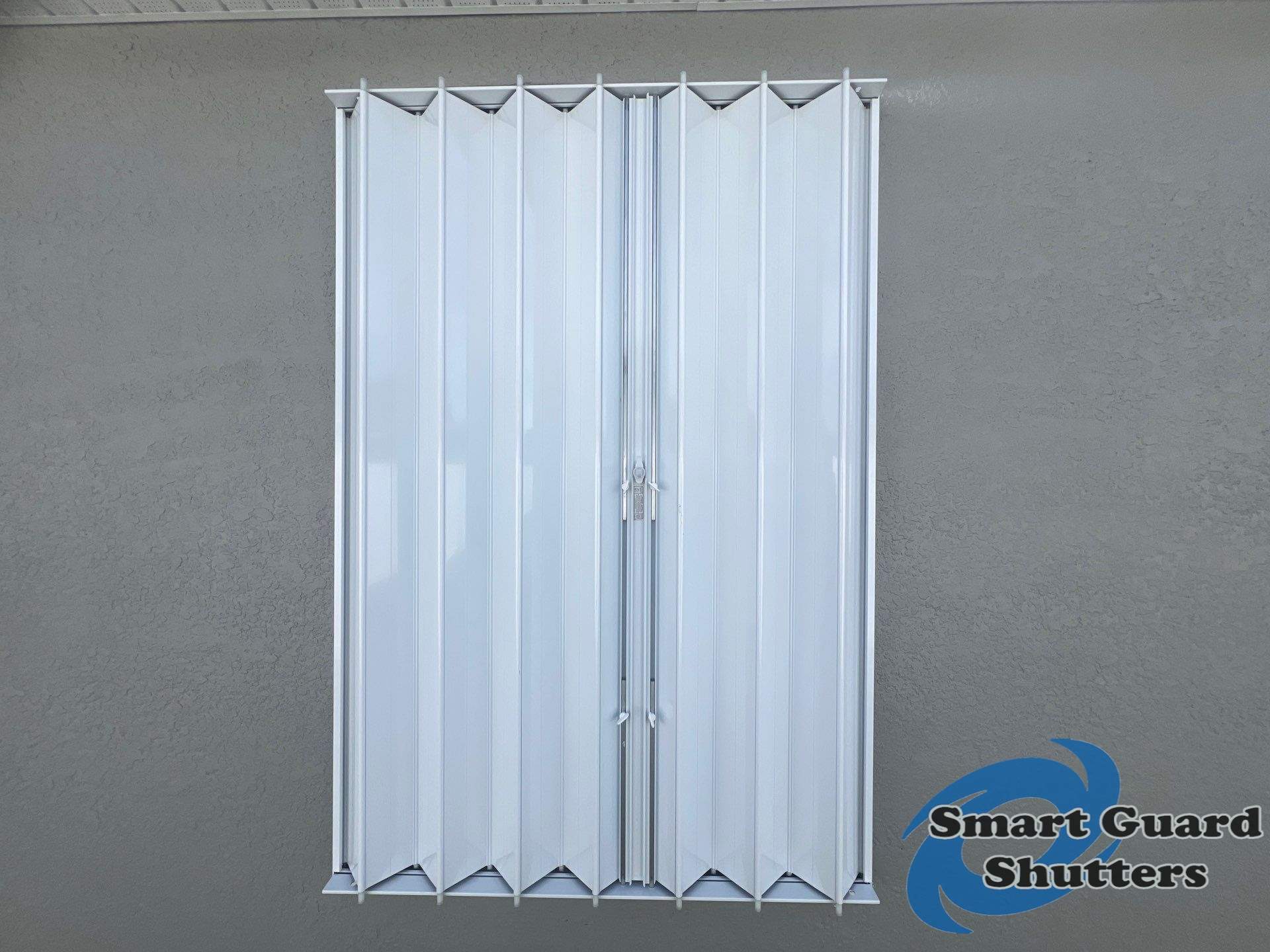 Accordion Shutters in White by Smart Guard Shutters