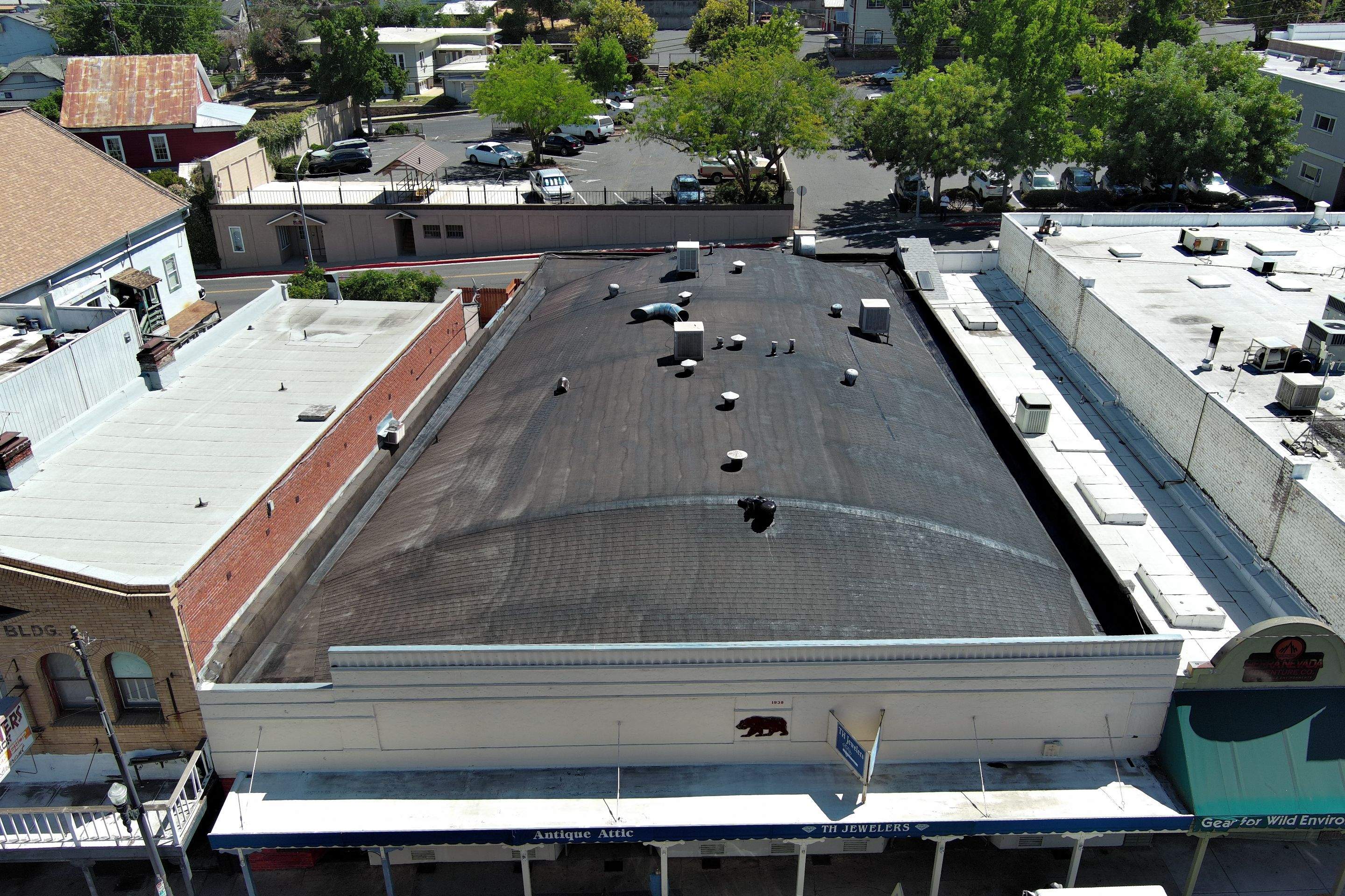 Foam and coatings on commercial roof by Straight Edge Roofing Inc